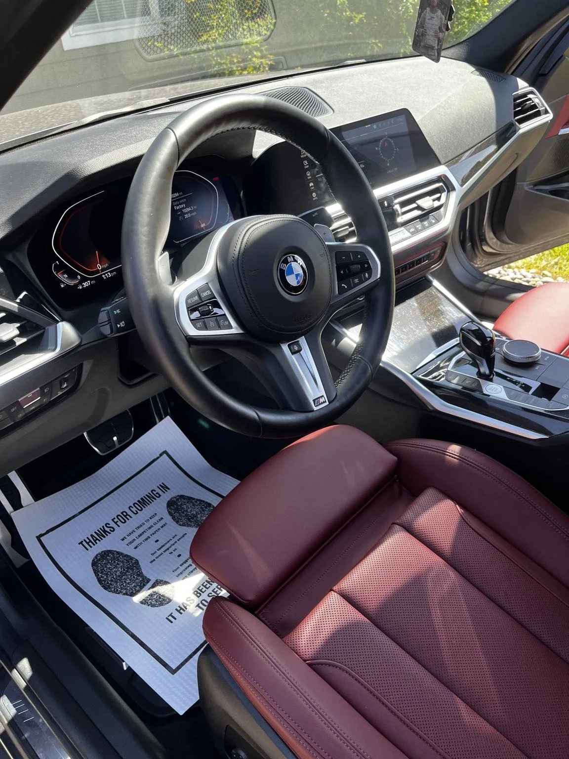 BMW red leather front inteiror after professional interior detailing in Lakewood, WA by Bryanz Auto Detailing