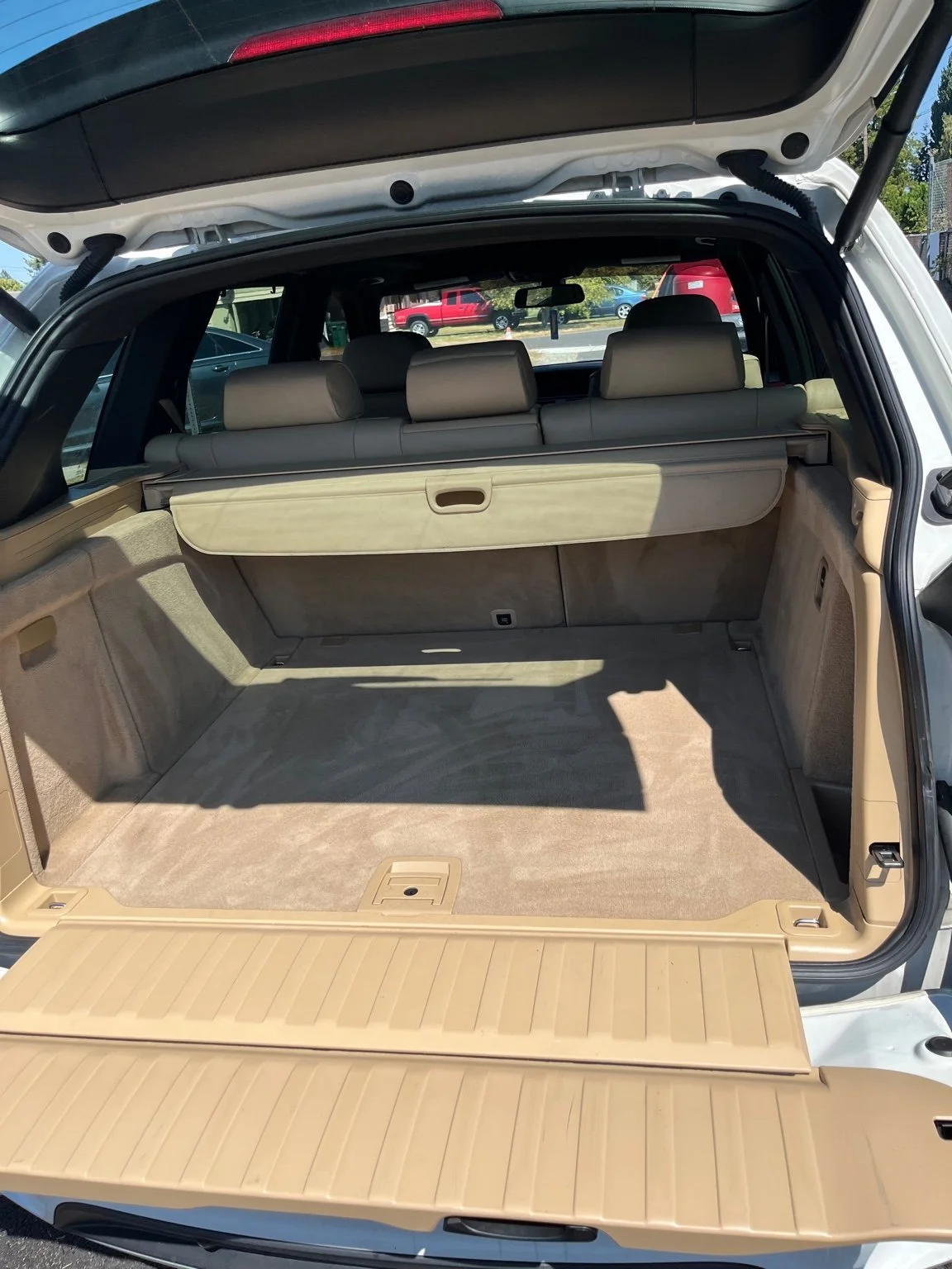BMW X5 cargo area fully restored after deep interior cleaning by Bryanz Auto Detailing.
