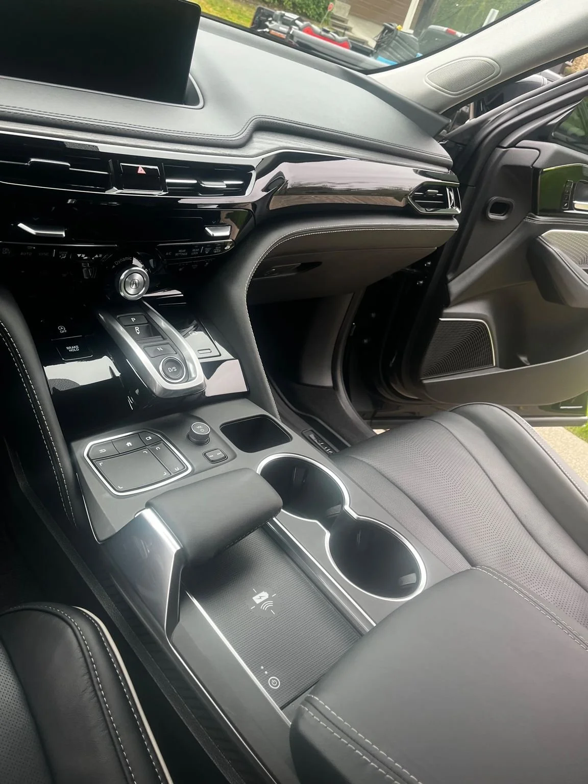 Acura MDX interior detailing in Graham, WA with deep cleaning of center console and leather seats.