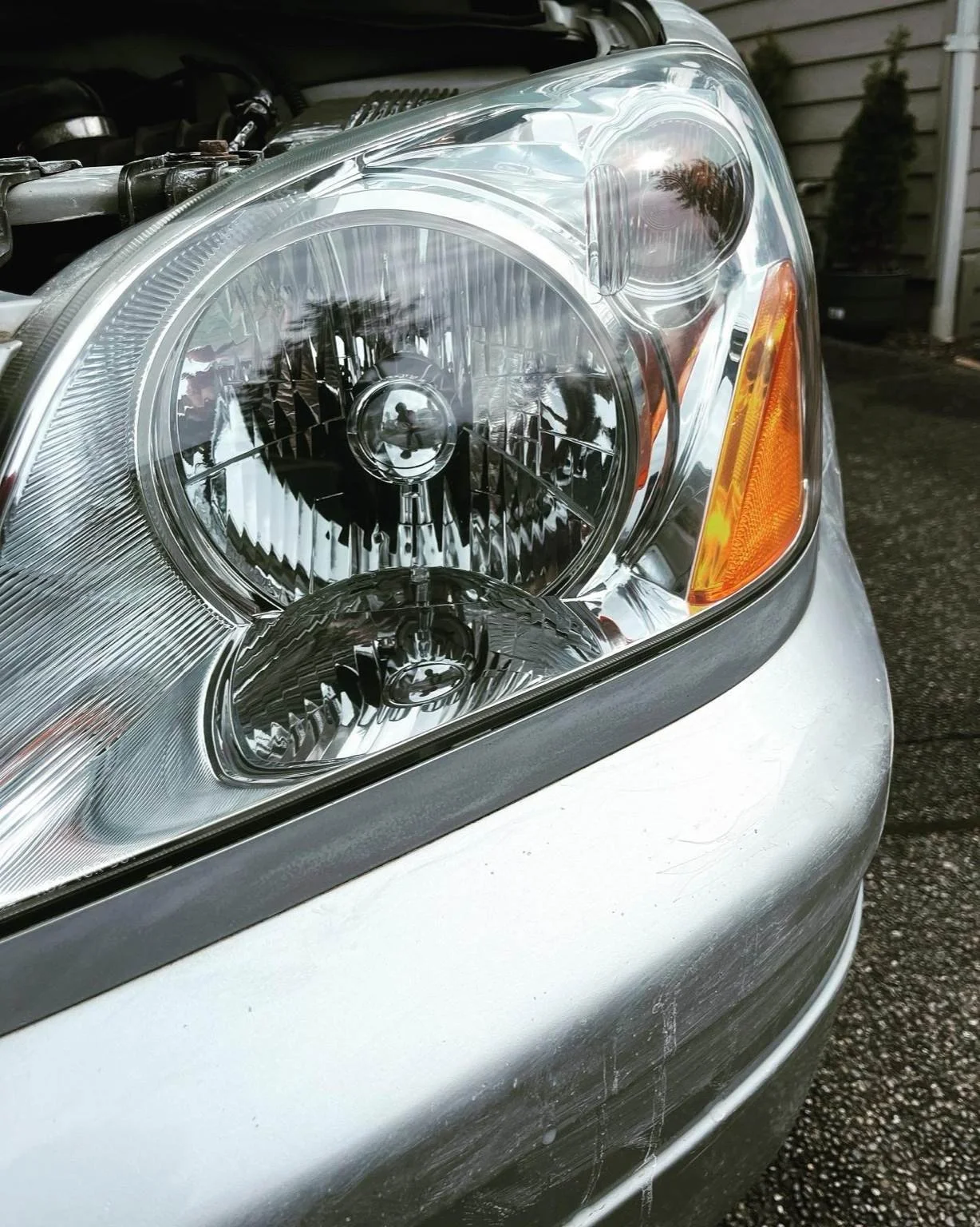 Clear restored vehicle headlight after professional headlight restoration in Kent, WA