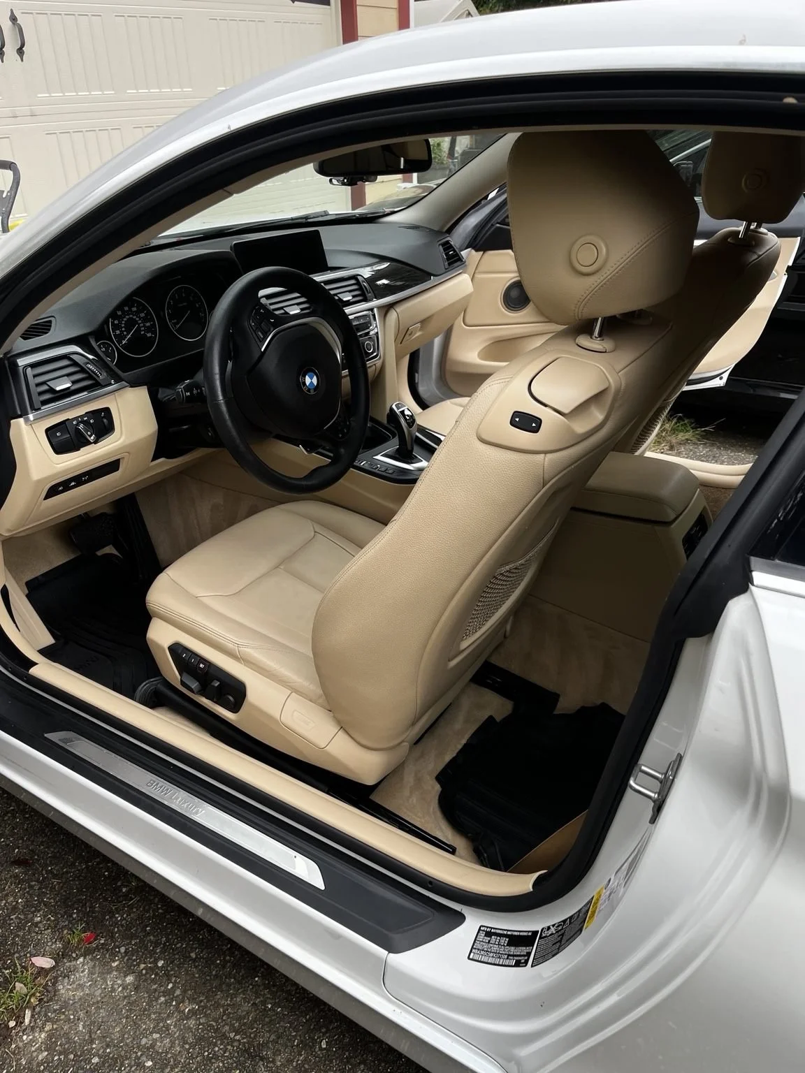 Detailed BMW beige leather front interior by Bryanz Auto Detailing
