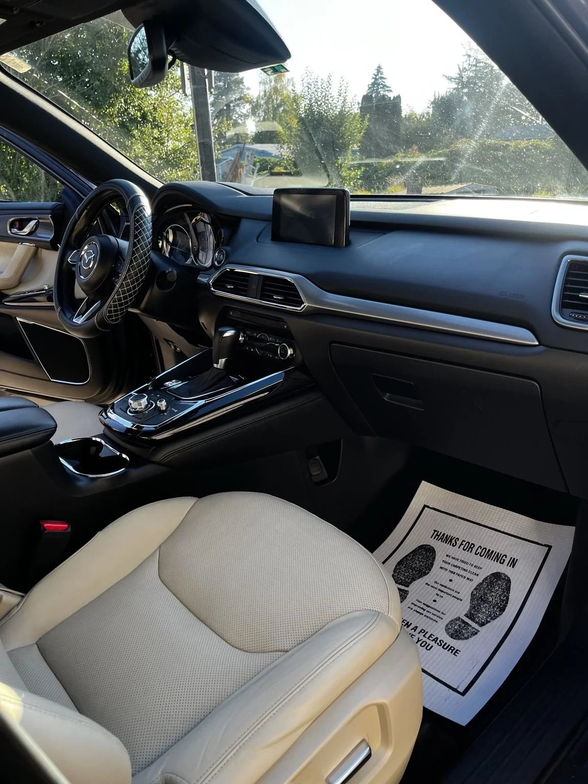 Mazda front passenger seat dashboard and center console after interior detailing in Tacoma, WA