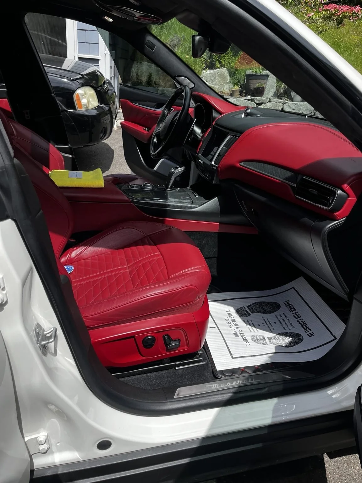 Professional Maserati interior detailing with red leather seat restoration and luxury mobile detailing service near Gig Harbor WA