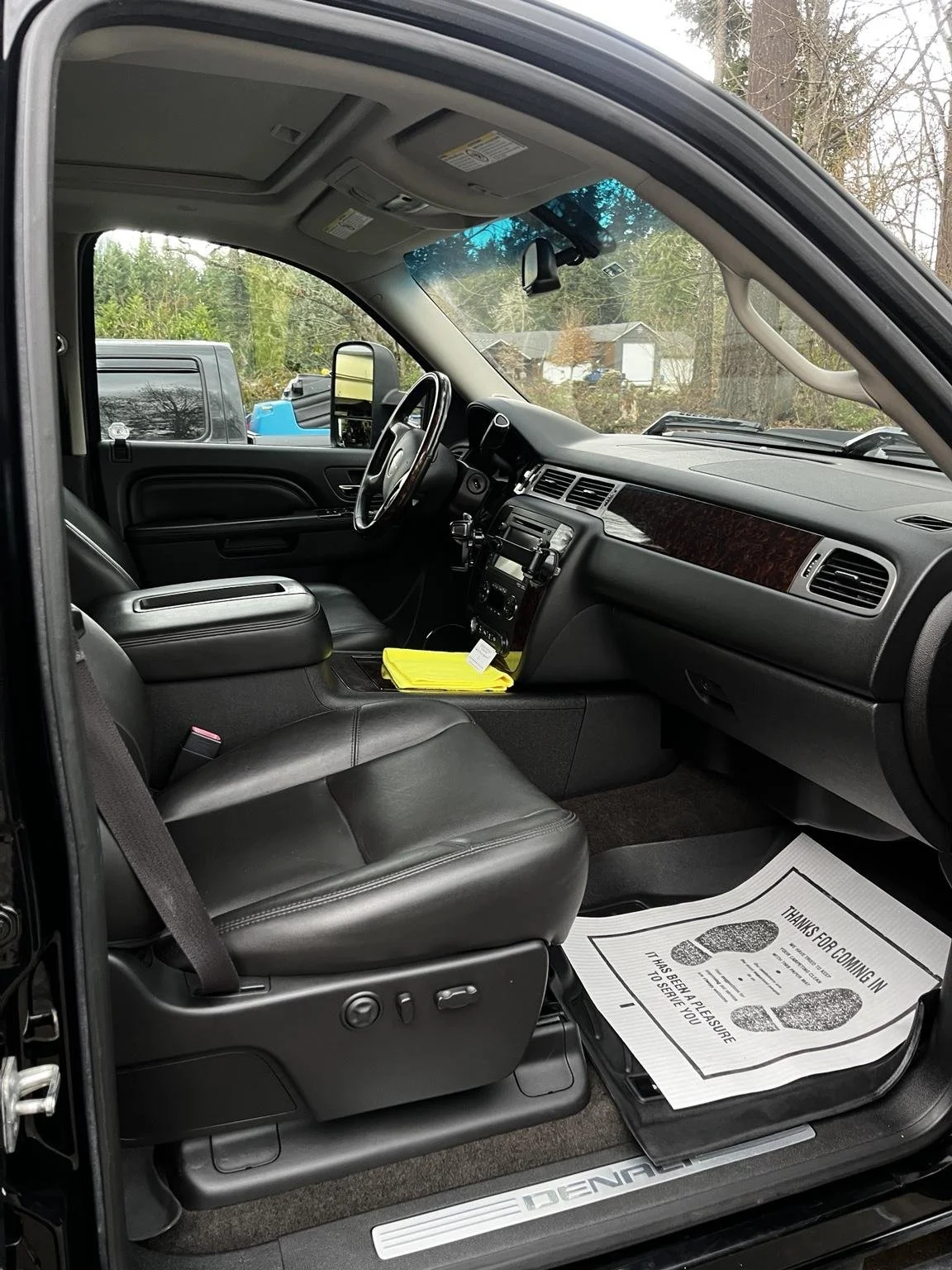 Mobile car detailing in Lake Tapps WA - interior detailing on GMC Sierra passenger seat and dashboard with clean finish