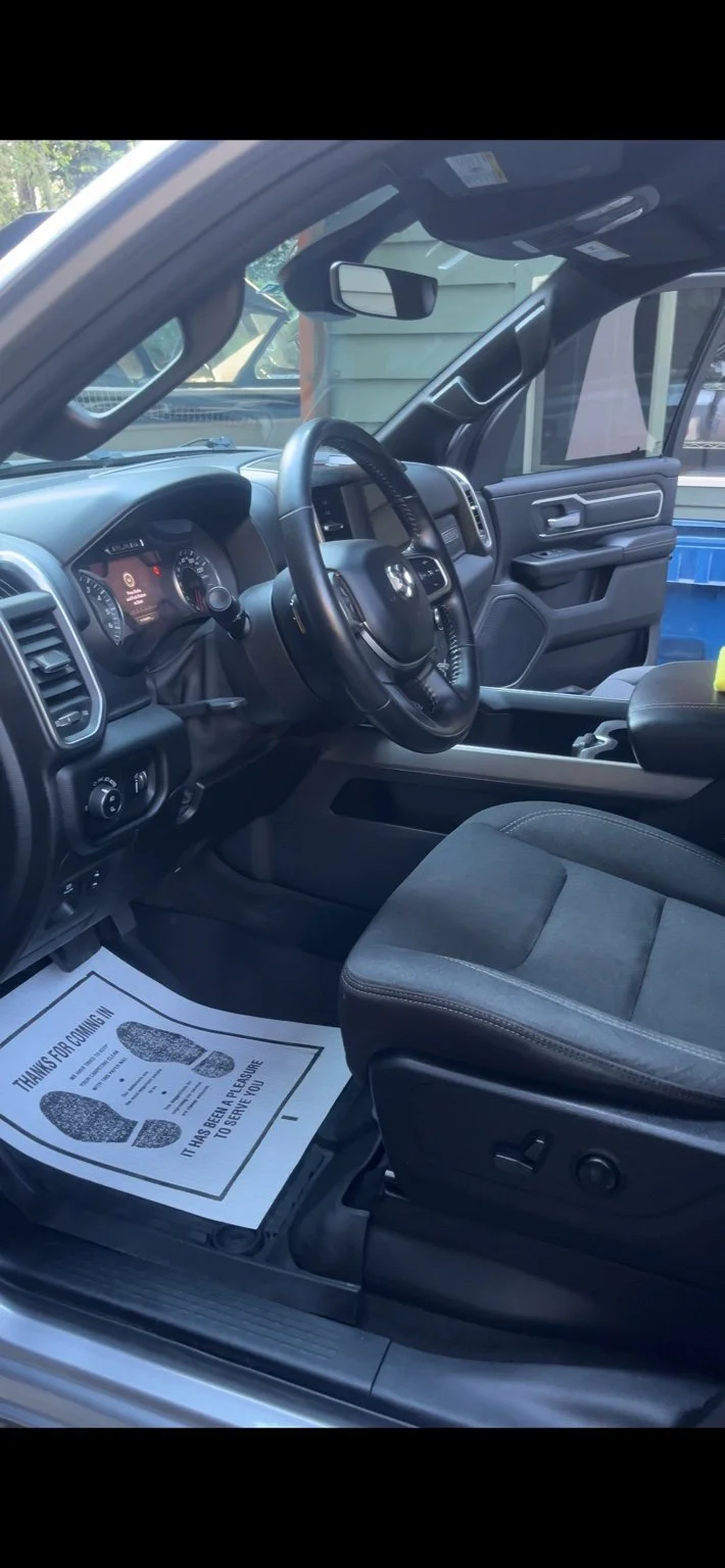 Ram truck front interior detailing with clean seats, dashboard, and center console after mobile detailing in Maple Valley WA