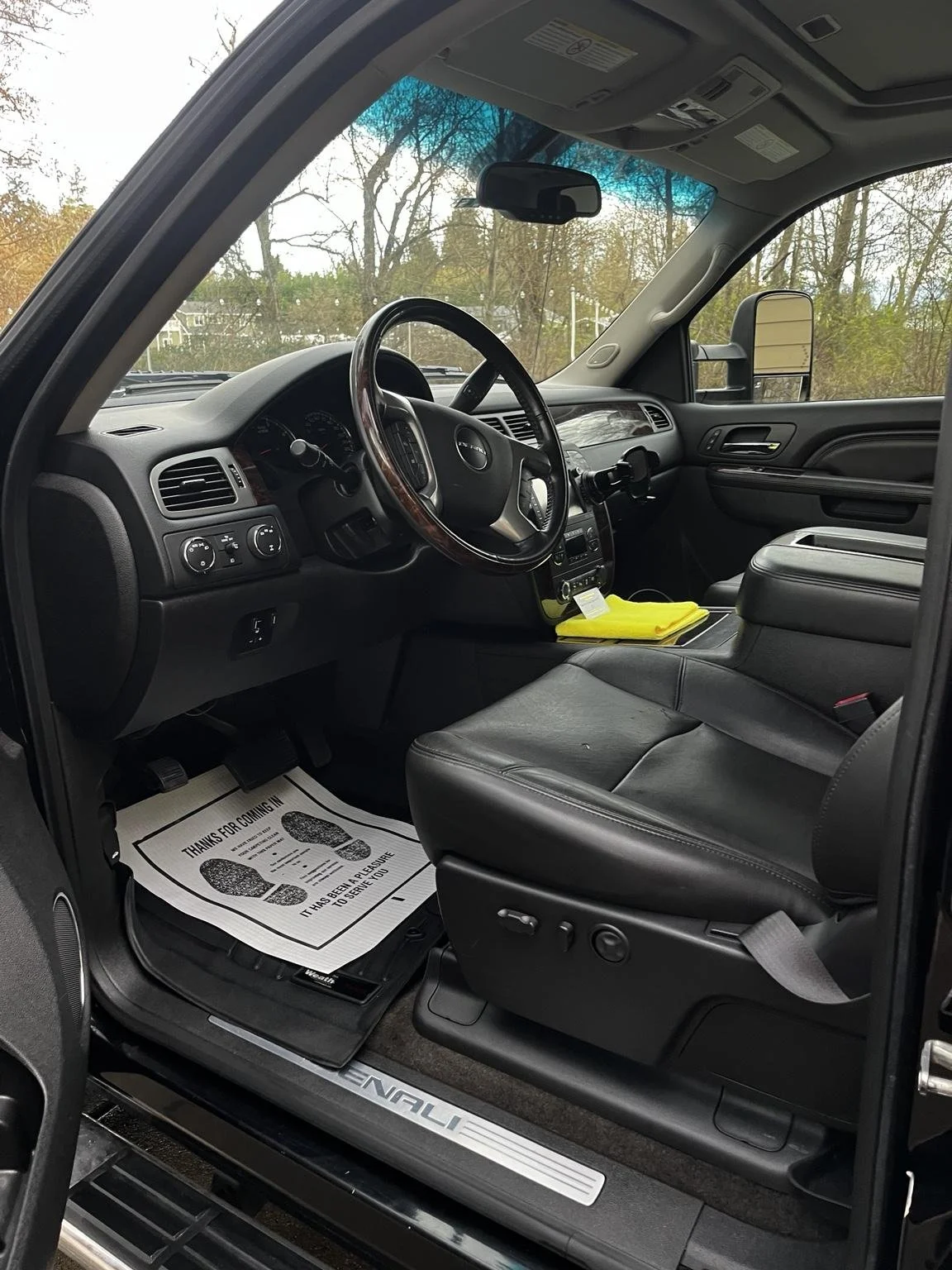 Mobile car detailing in Lake Tapps WA - interior detailing on GMC Sierra with clean driver seat, dashboard, and floor mats