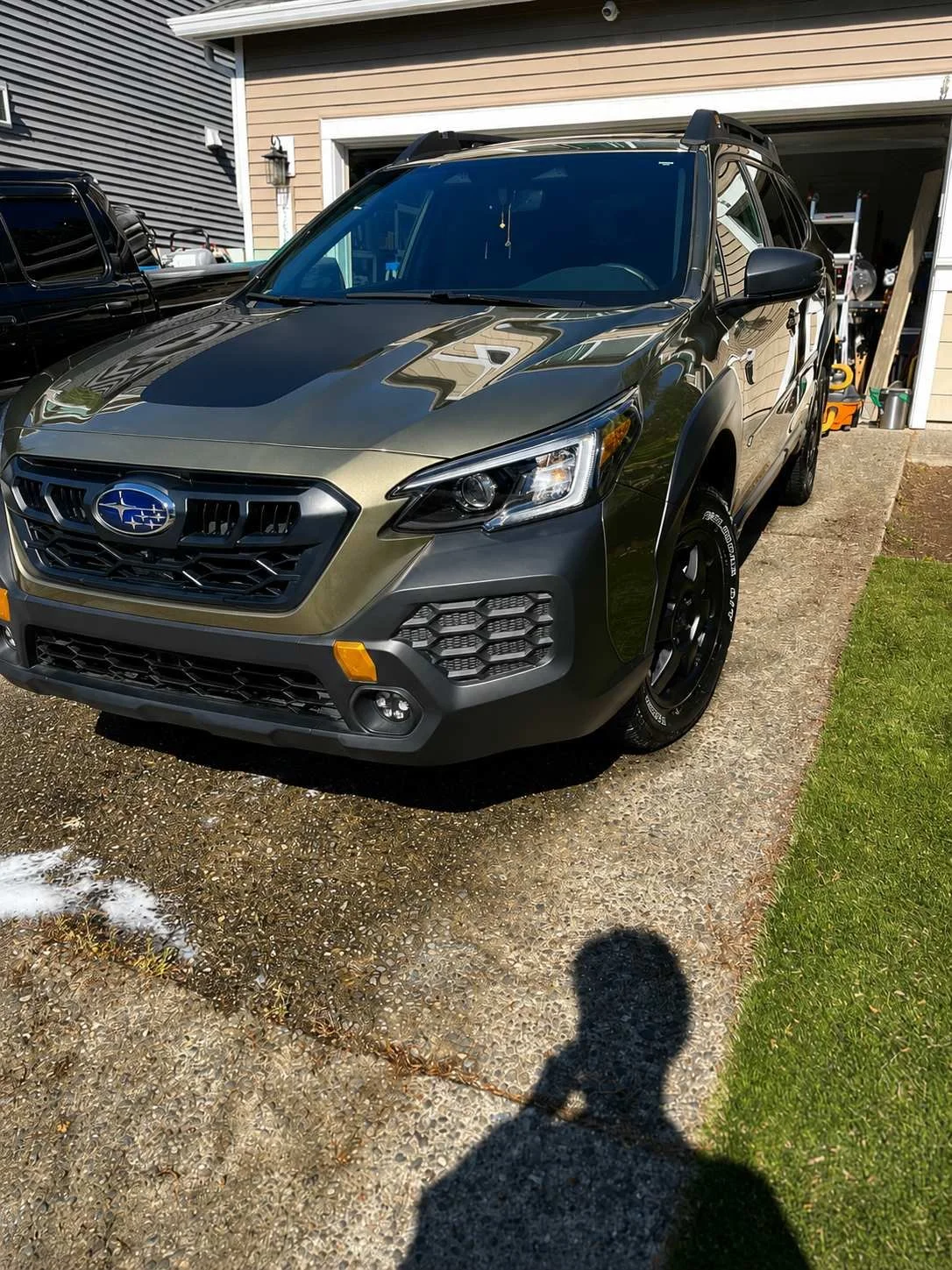 Angled view of Subaru Outback after exterior wash and wax mobile detailing service in Maple Valley WA by Bryanz Auto Detailing featuring paint gloss enhancement, tire shine, exterior cleaning, SUV detailing, and professional mobile auto detailing