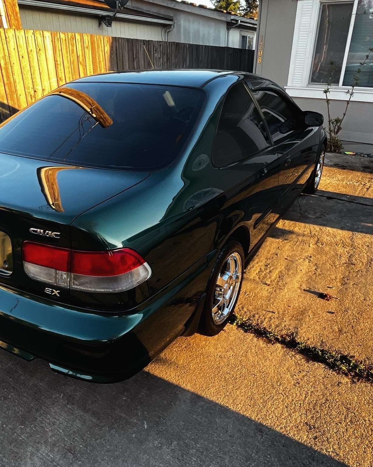 Green Honda Civic after full paint correction and polishing by Bryanz Auto Detailing in Washington.