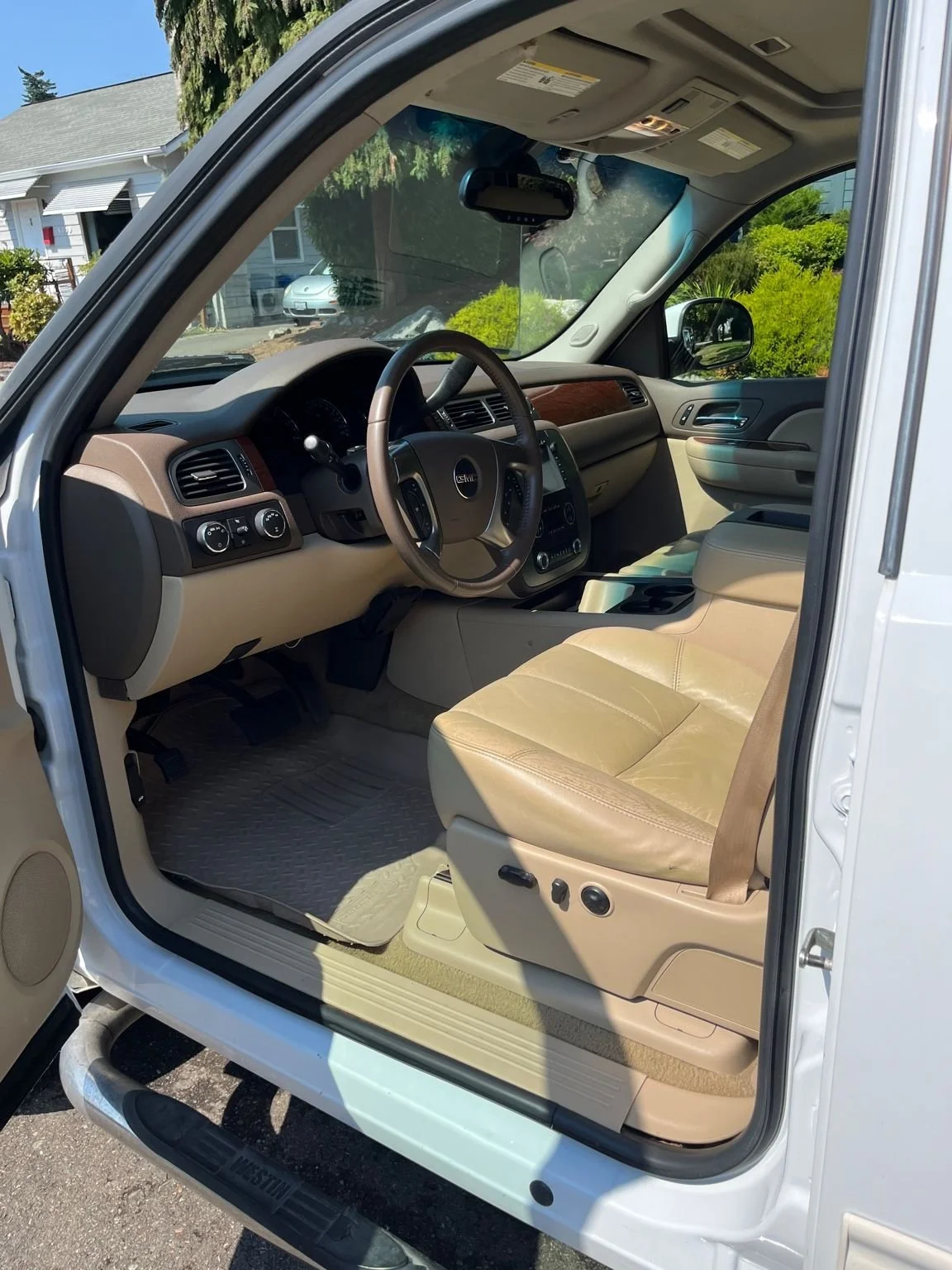 Full interior detail on a GMC Sierra featuring leather seat cleaning, dashboard restoration, and deep vacuuming.