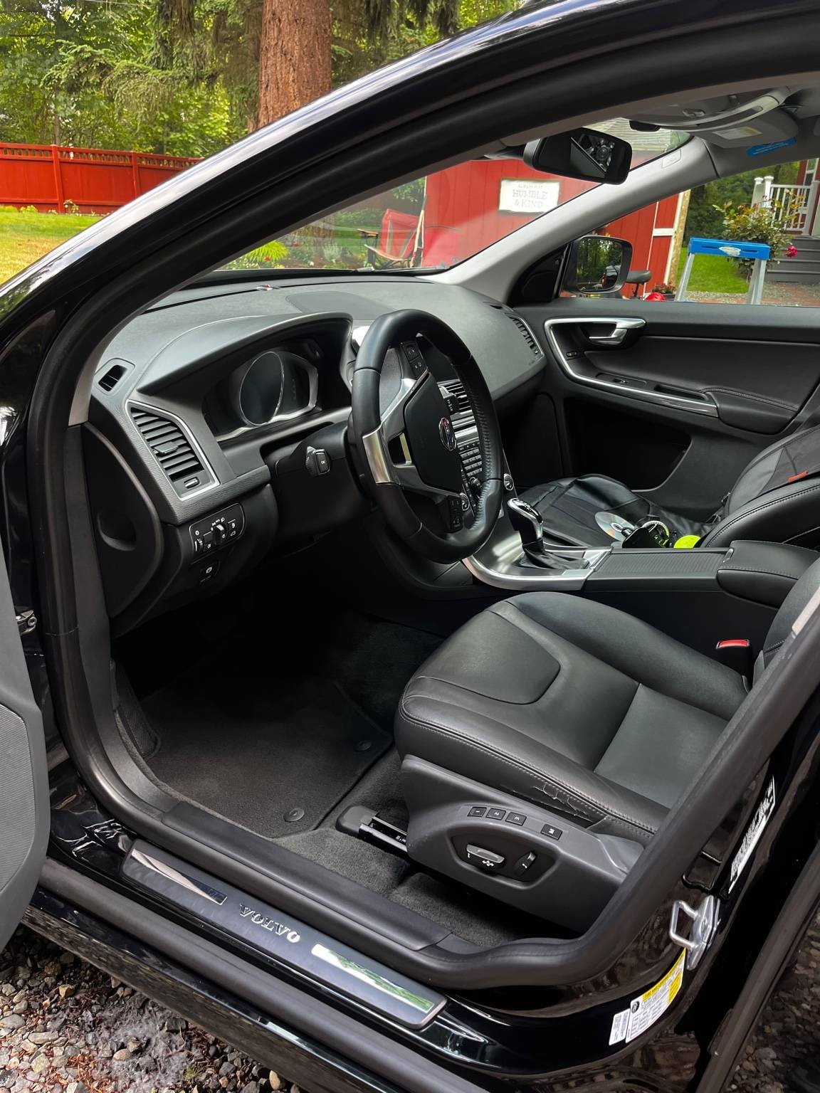 Volvo interior detailing with deep-cleaned leather front seat, restored cabin surfaces, and refreshed driver area.