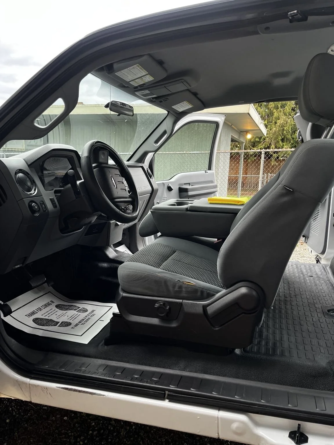 Professional truck interior detailing service in Maple Valley WA deep cleaning a work vehicle interior with spotless floors and seats