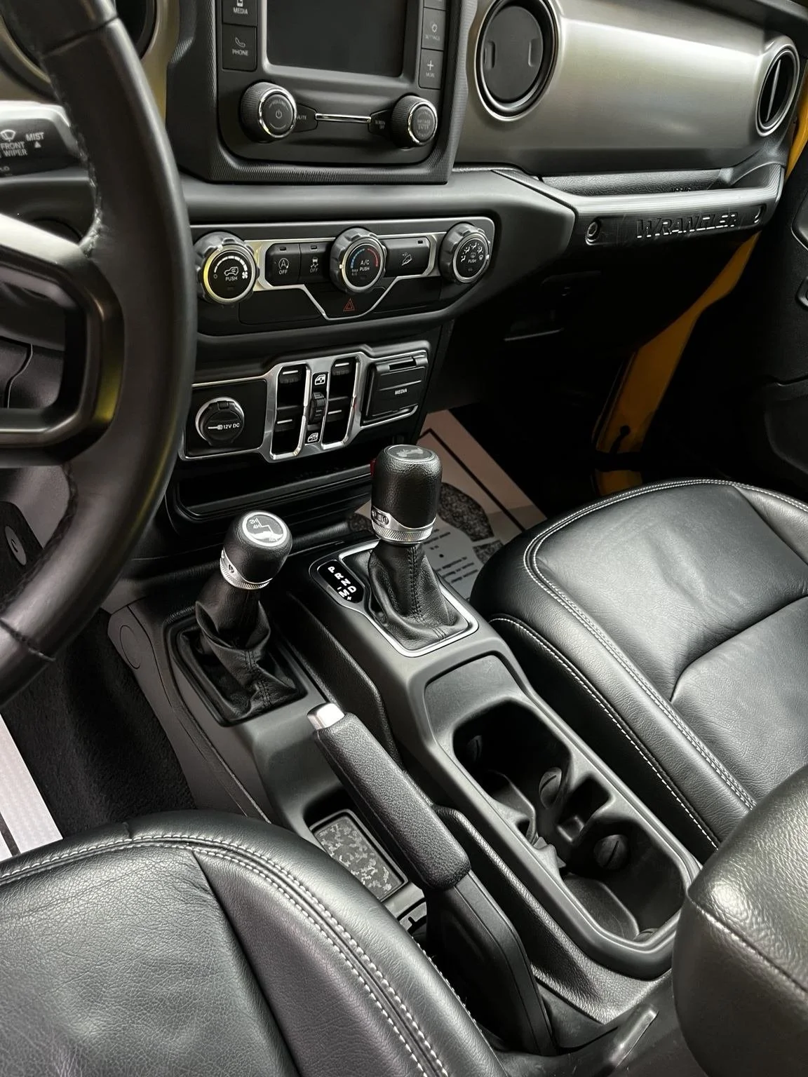 Jeep Wrangler center console and front interior after professional detailing in Burien, WA by Bryanz Auto Detailing