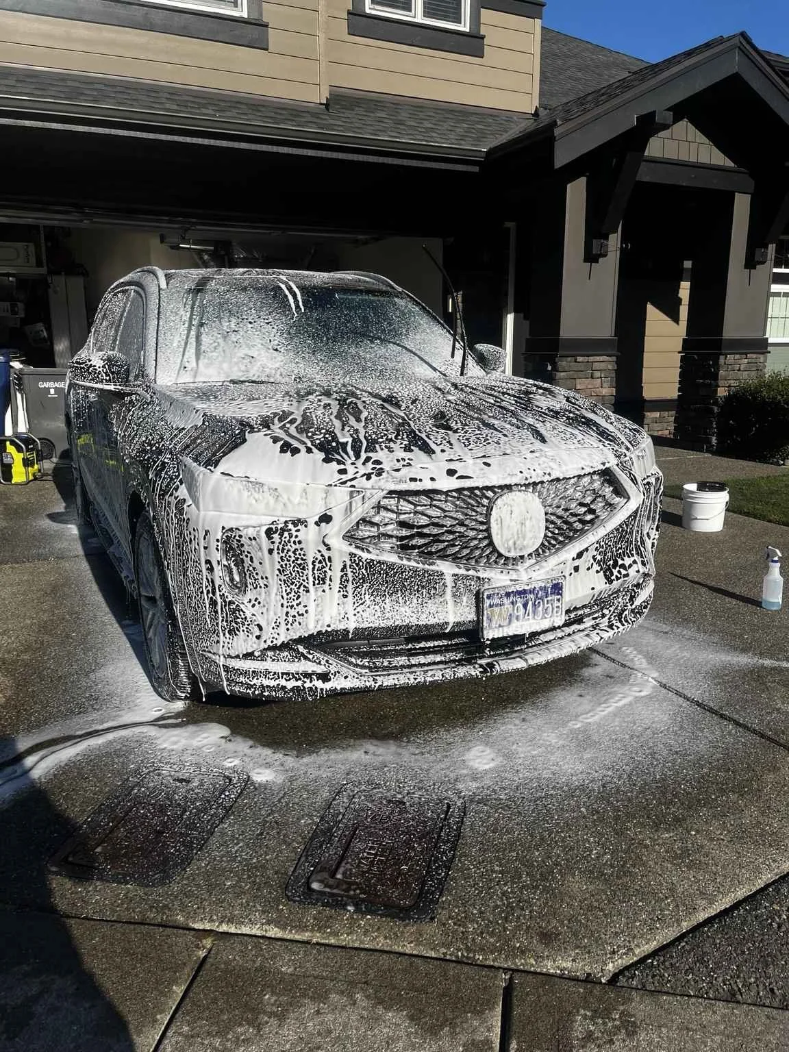 Acuara MDX receiving a professional foam wash by Bryanz Auto Detailing in Covington, WA before a premium exterior detailing and wash and wax service.