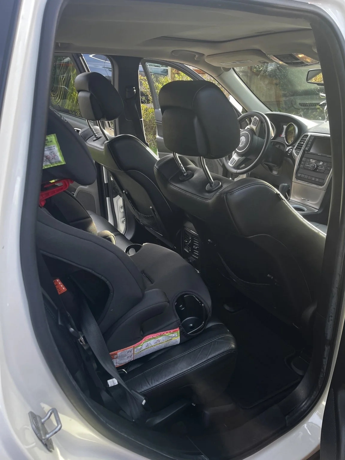 Mobile car detailing in Burien WA - car seat and back seat interior detailing on Jeep Grand Cherokee with deep cleaning and sanitized surfaces