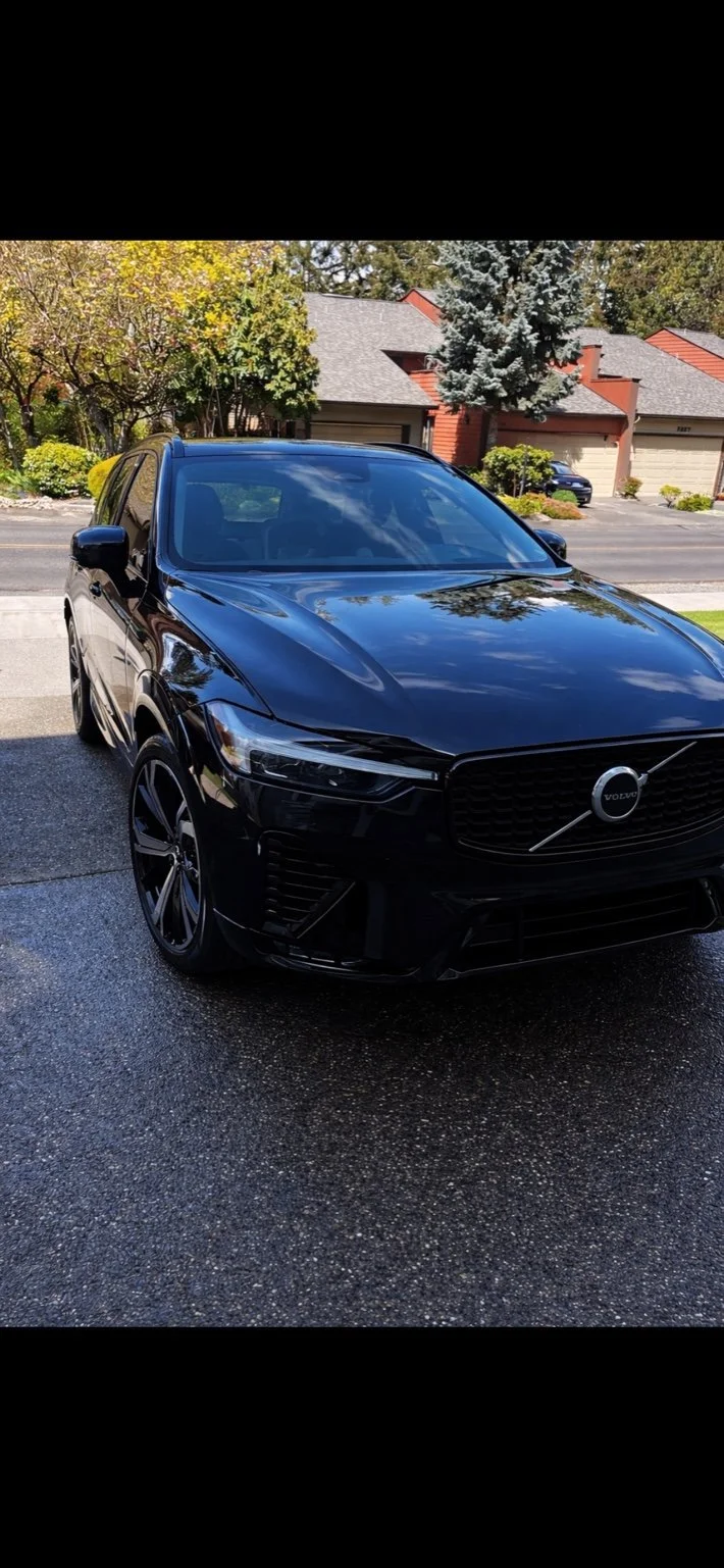 Black VOvo SUV after professional mobile detailing in Graham, WA with deep gloss and mirror-like reflections.