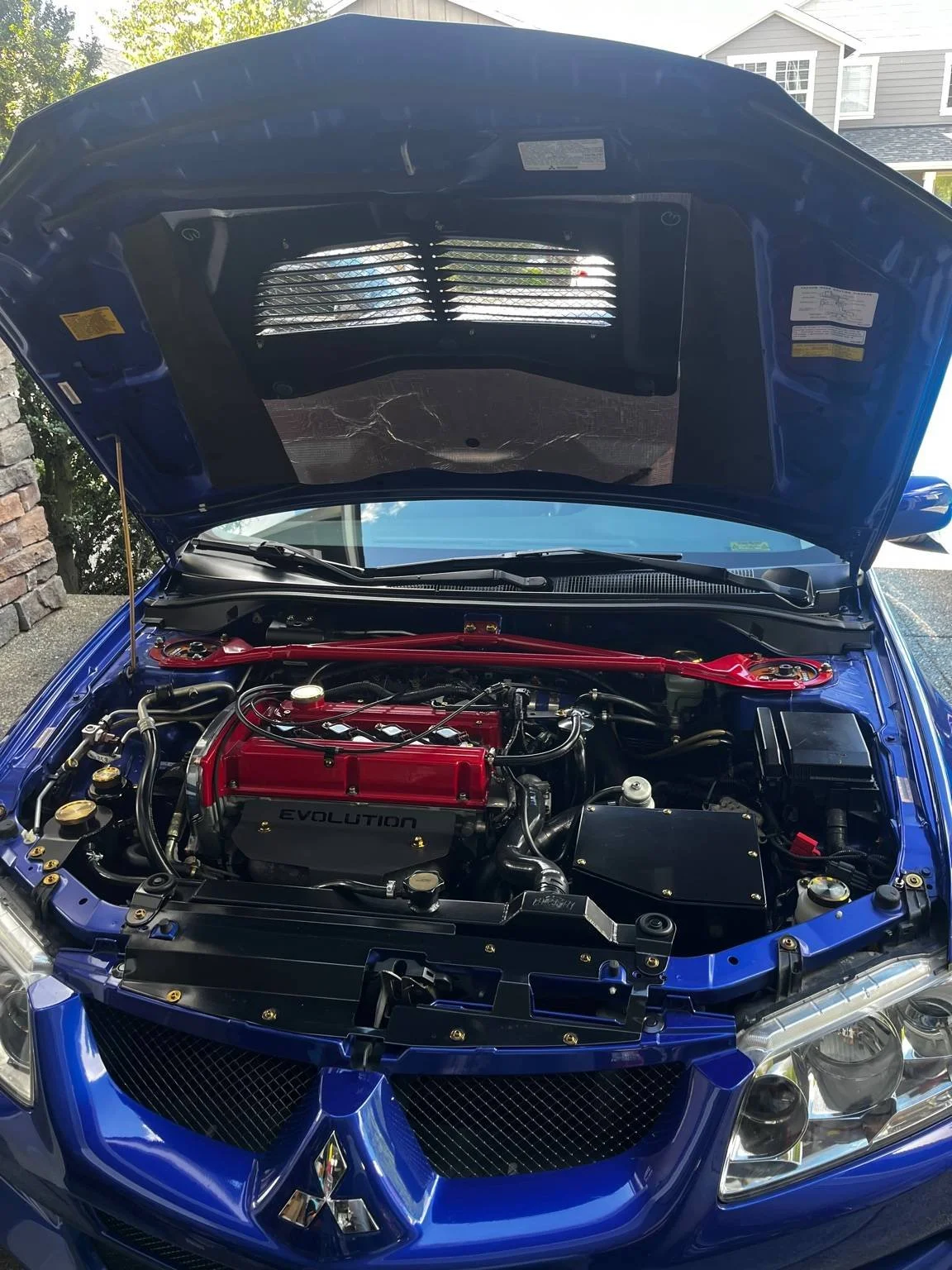 Clean engine bay detailing on a Mitsubishi Lancer Evolution by BryanzAutoDetailing.