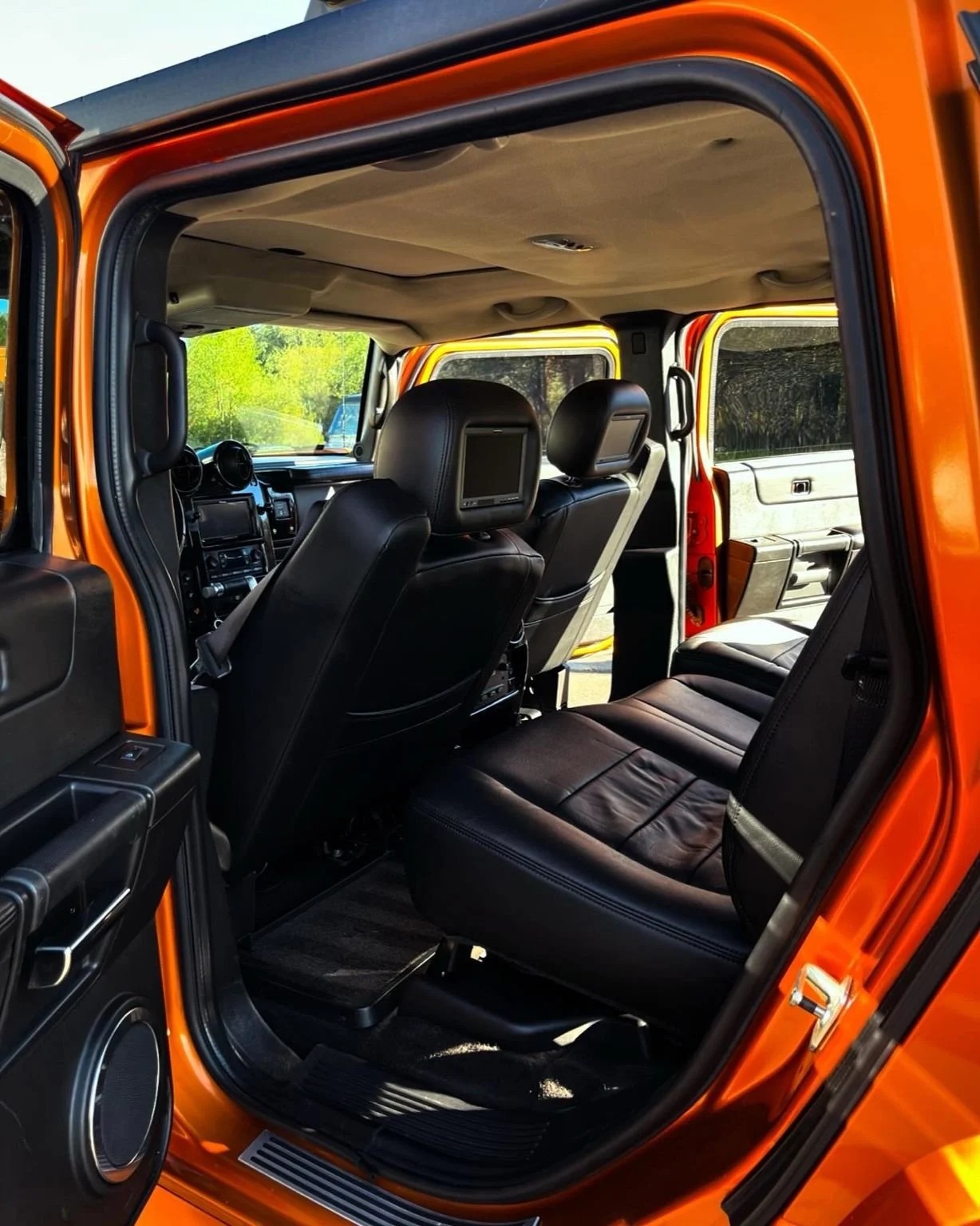 Full interior detail on a Hummer H2 including leather backseat cleaning, deep vacuuming, and complete cabin restoration.