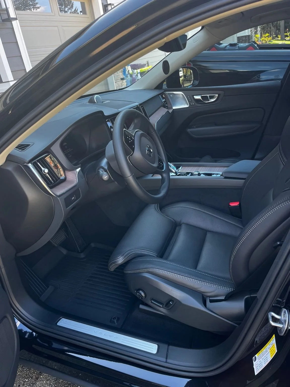 After interior detail of a Volvo with spotless black leather front seat and deep cleaned driver area by Bryanz Auto Detailing.