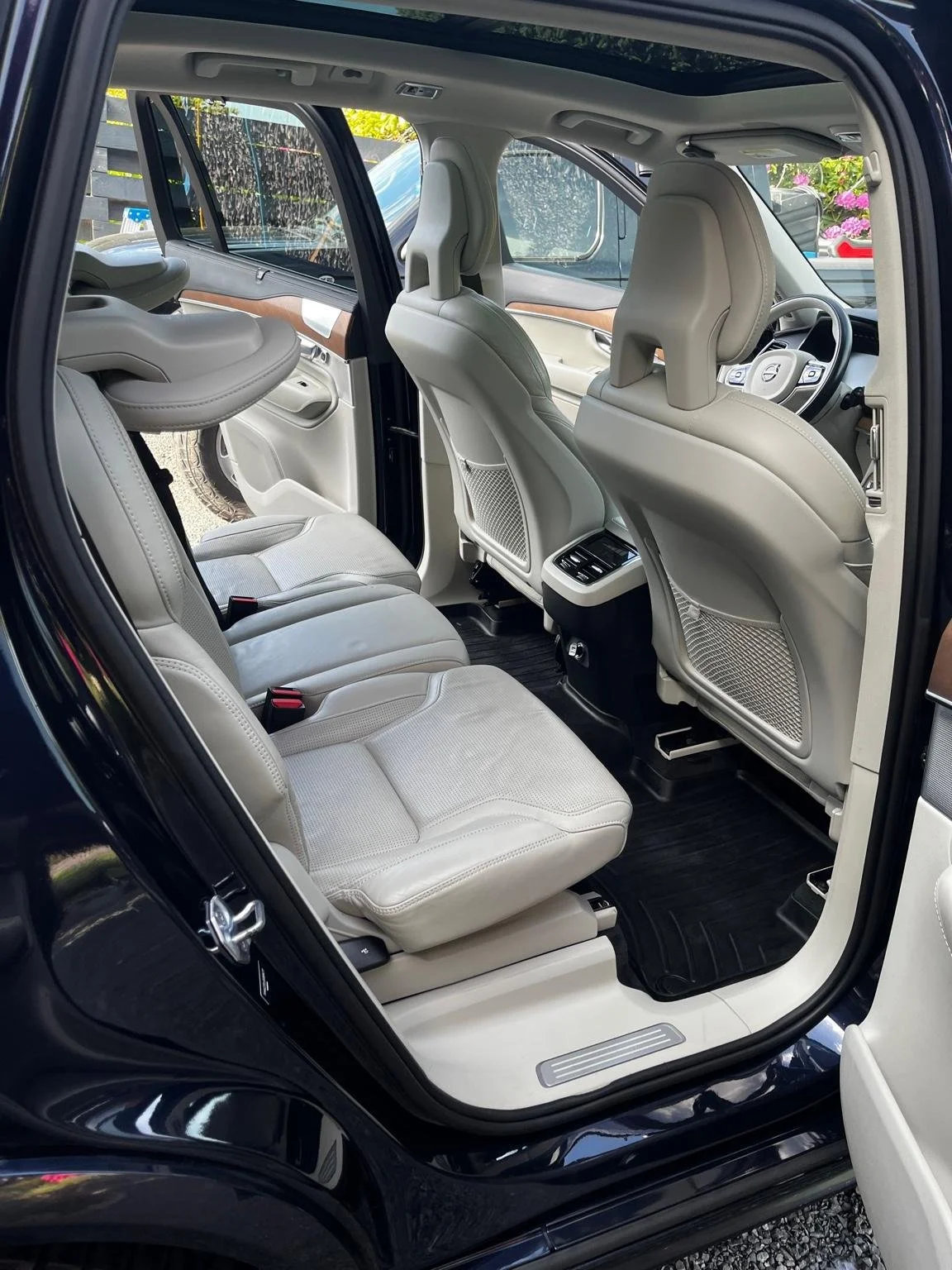 After interior detail of a Volvo XC90 with spotless light leather second-row seats and deep cleaned door panels by Bryanz Auto Detailing.