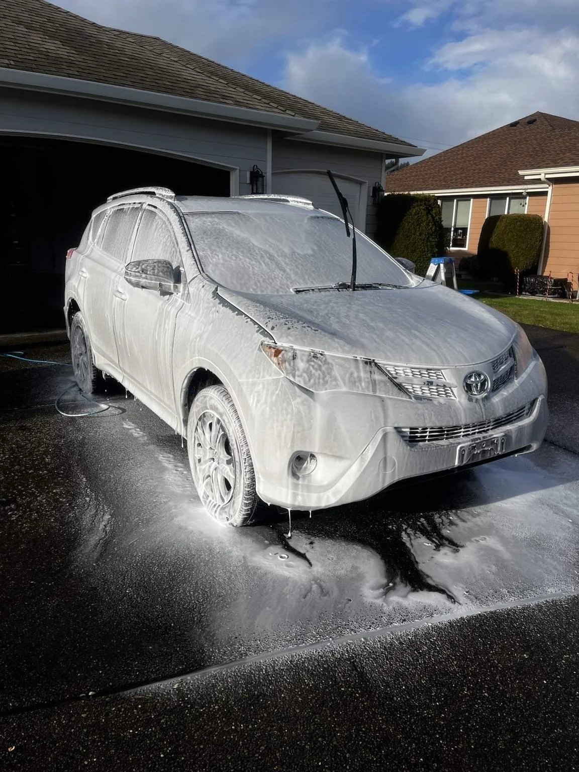 Professional Toyota RAV4 foam wash in Lakewood, WA by Bryanz Auto Detailing using a thick foam pre-wash to safely remove dirt before a premium hand wash and exterior detailing service.