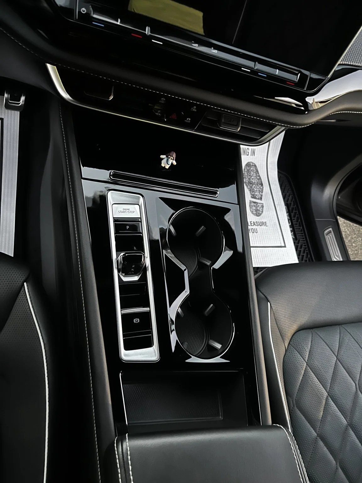 Volkswagen interior detailing in Renton Wa showing cleaned center console cup holders and luxury interior finish by Bryanz Auto Detailing