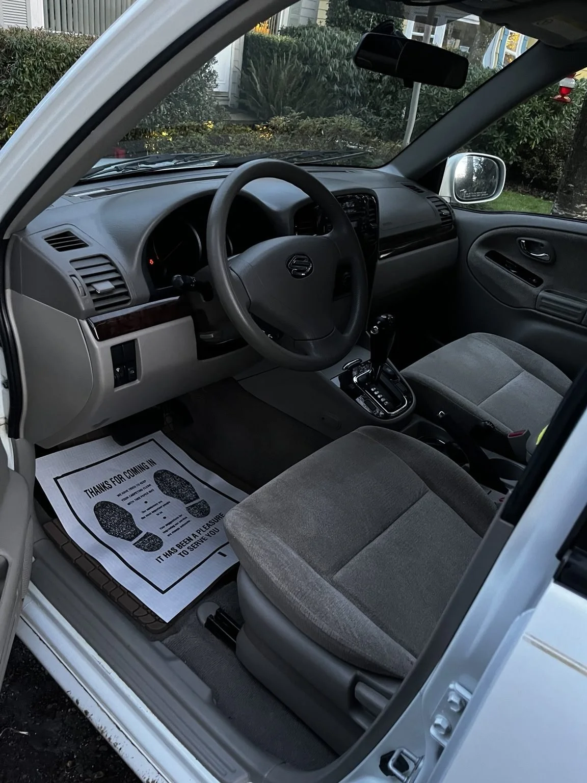 Clean gray cloth seats, dashboard, and center console after mobile interior car detailing in Bothell, WA by Bryanz Auto Detailing.