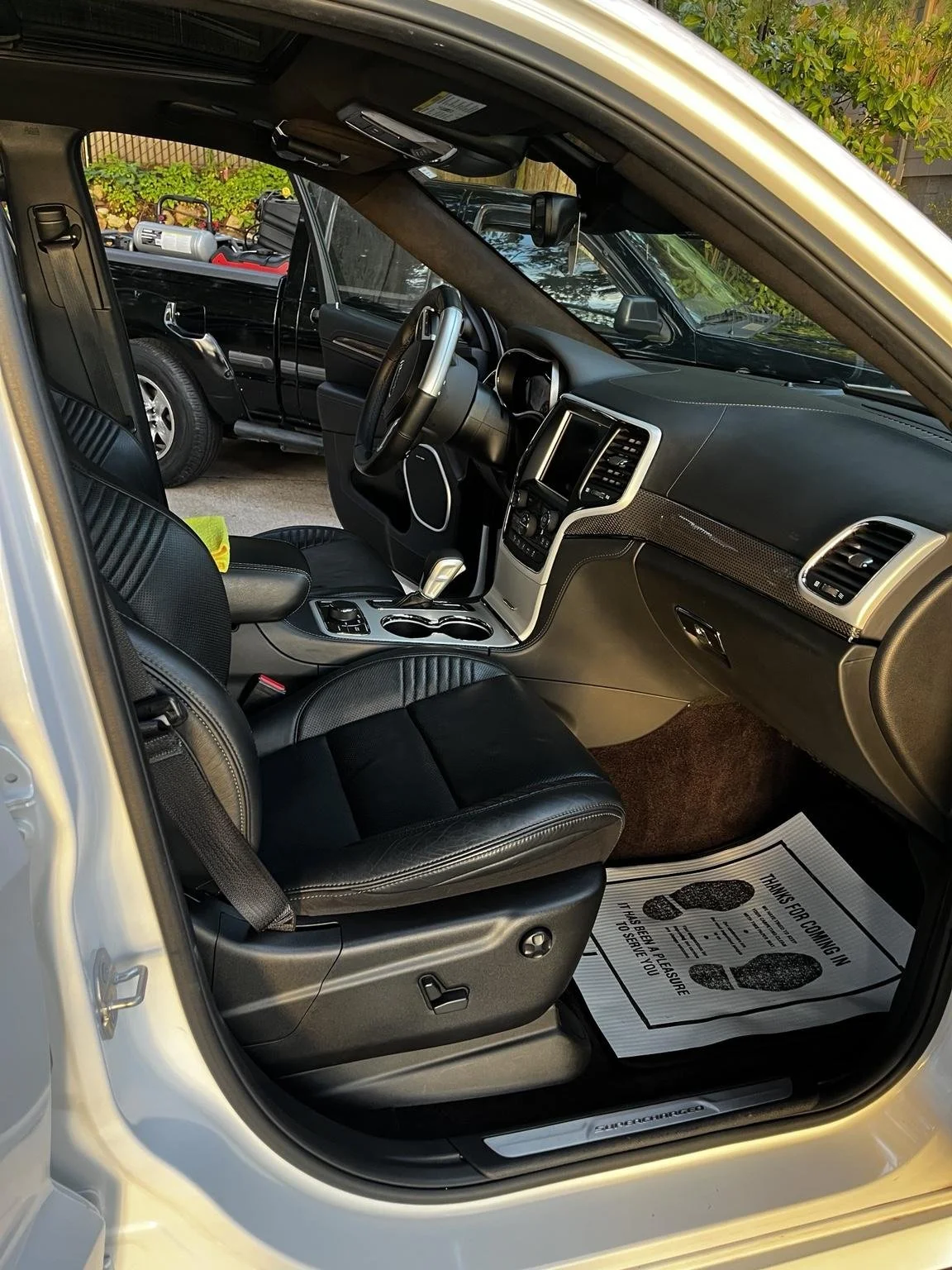 Jeep Trackhawk interior detailing clean leather seats and center console in Burien Wa