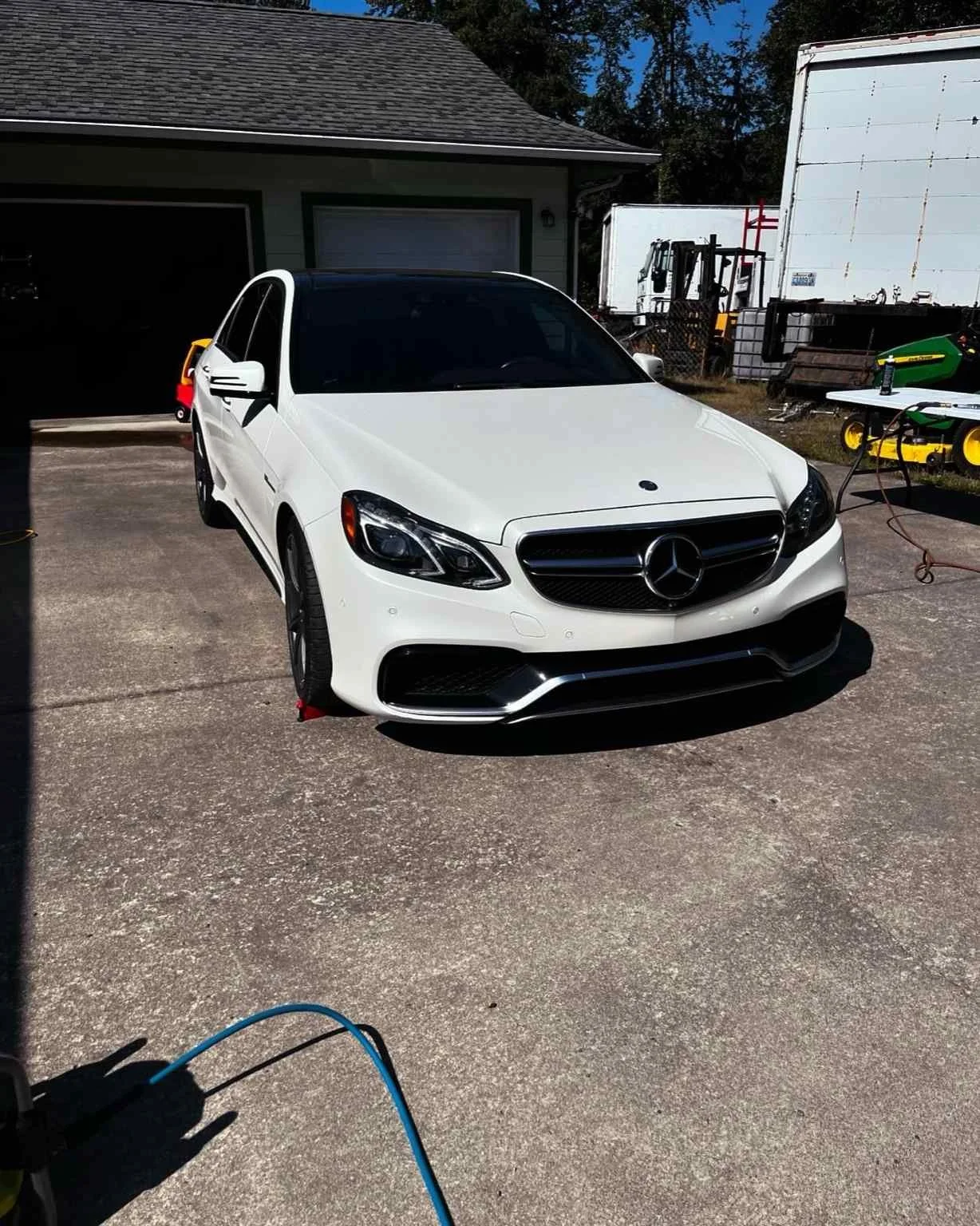 Mercedes-Benz sedan after professional wash and wax - exterior detailing with deep shine and paint protection.