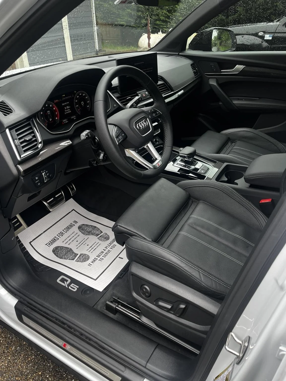 Audi Q5 interior detailing completed by Bryanz Auto Detailing in Covington, WA featuring deep cleaned leather seats, dashboard, center console, and premium interior finish.