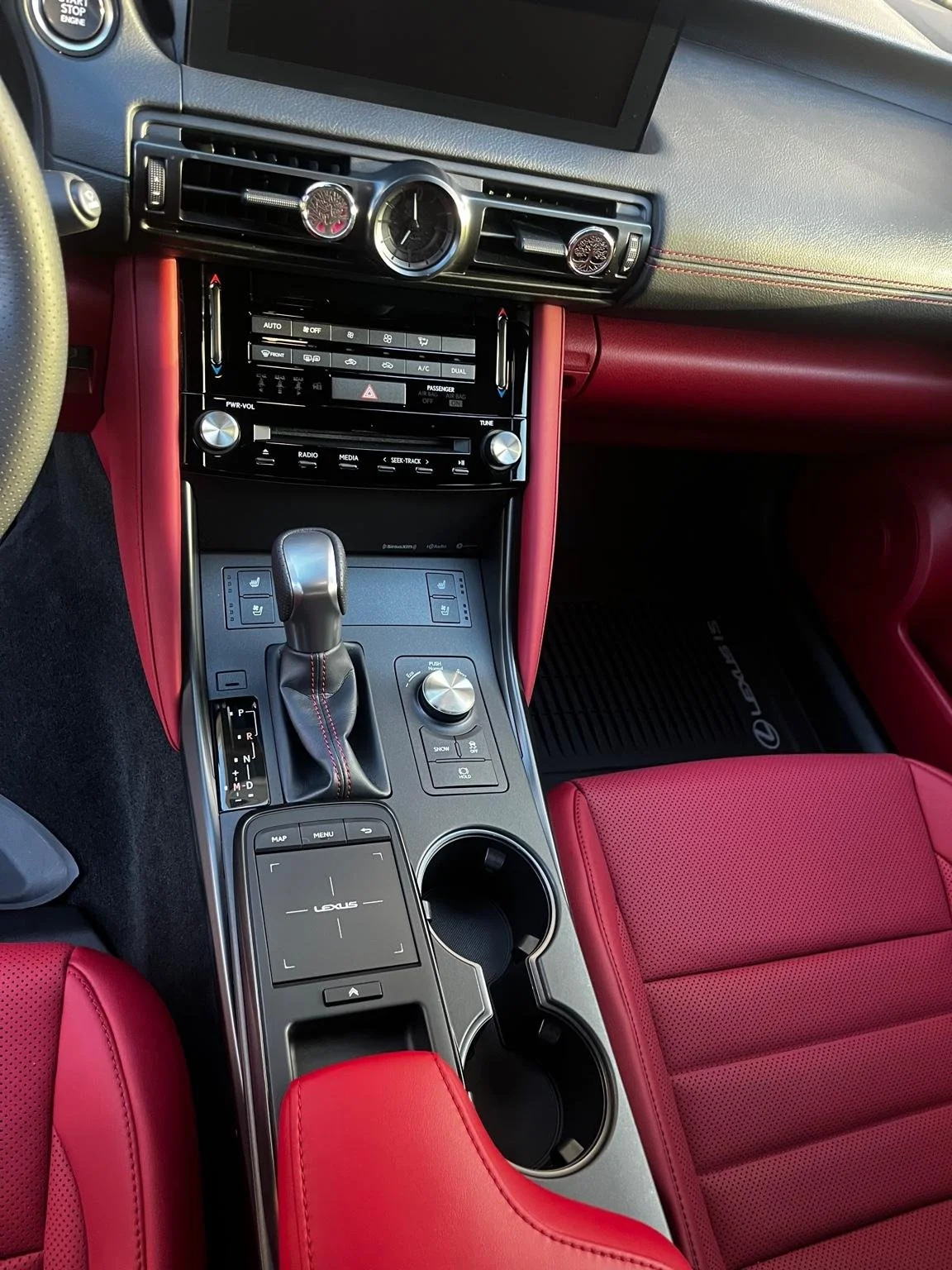Detailed Lexus interior with red leather seats and spotless center console after mini interior detail by Bryanz Auto Detailing.