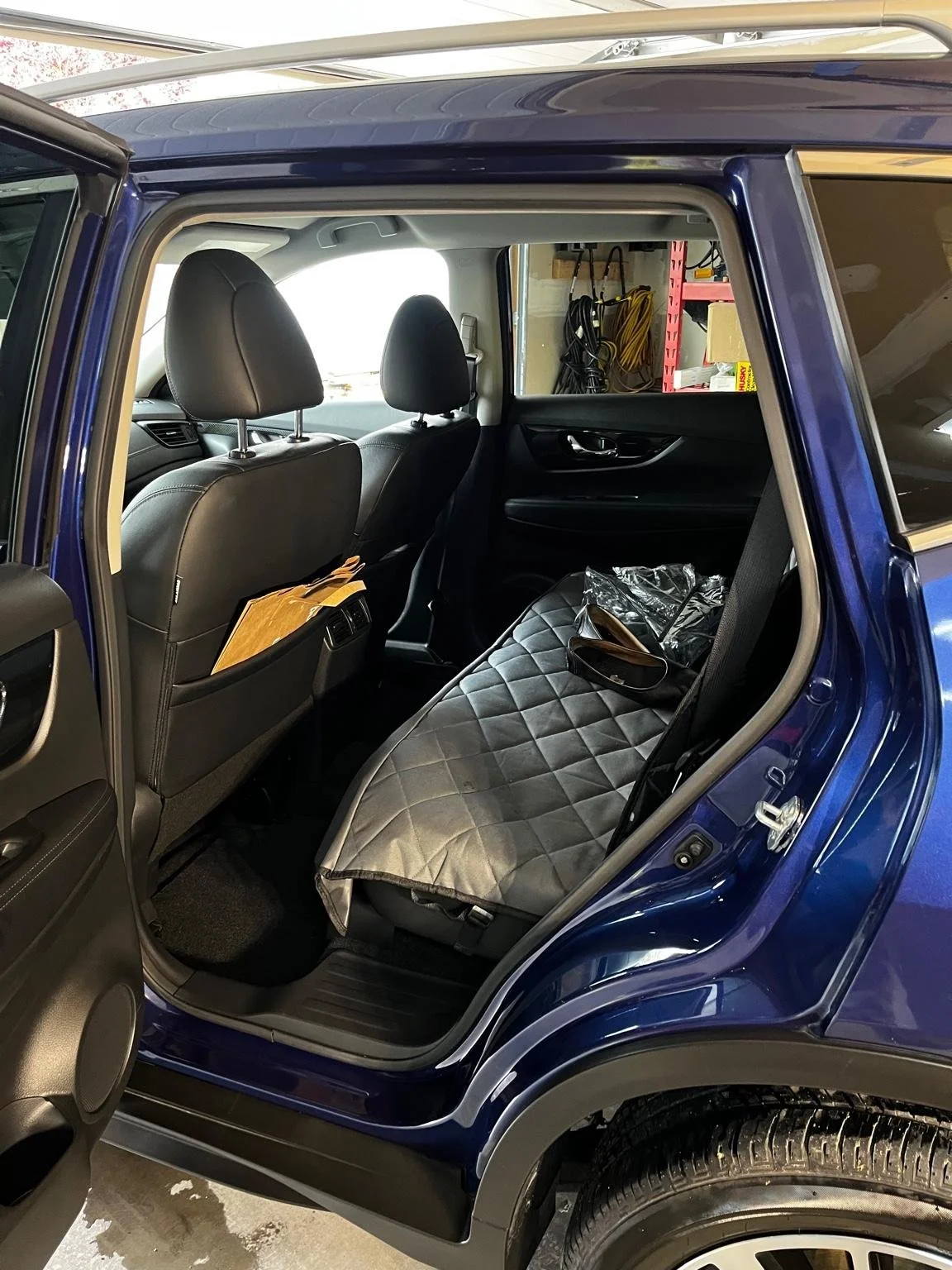 After mini interior detail on a Nissan Rogue with clean black leather seats and spotless rear cabin, professionally detailed by Bryanz Auto Detailing.