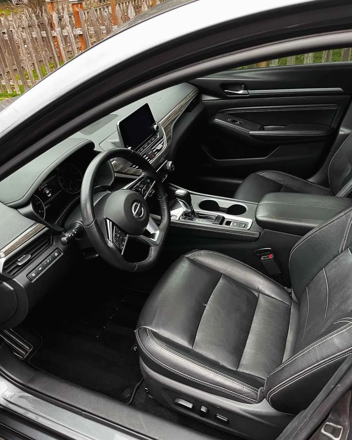 Full interior detail on a Nissan Altima featuring leather seat cleaning, dashboard restoration, and deep vacuuming.