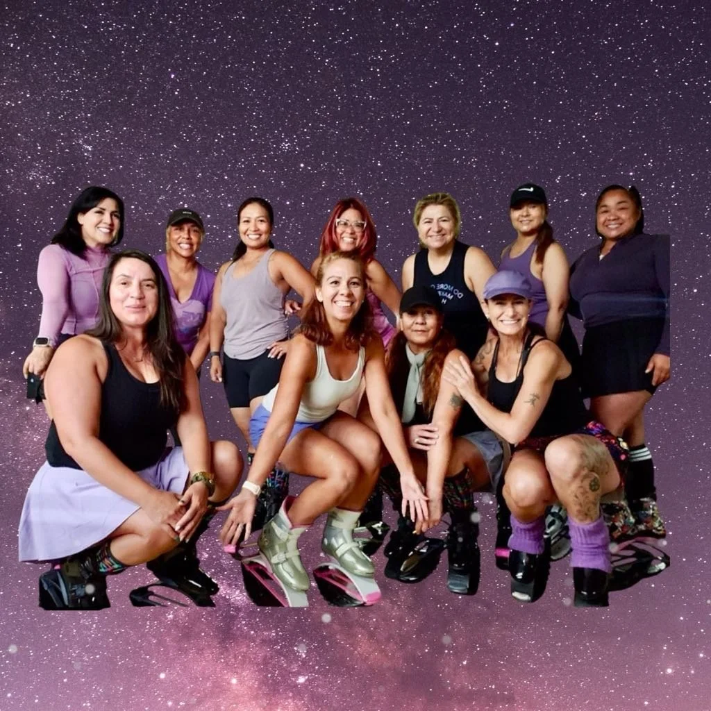 Group of women posing with fitness boots against a starry sky backdrop.