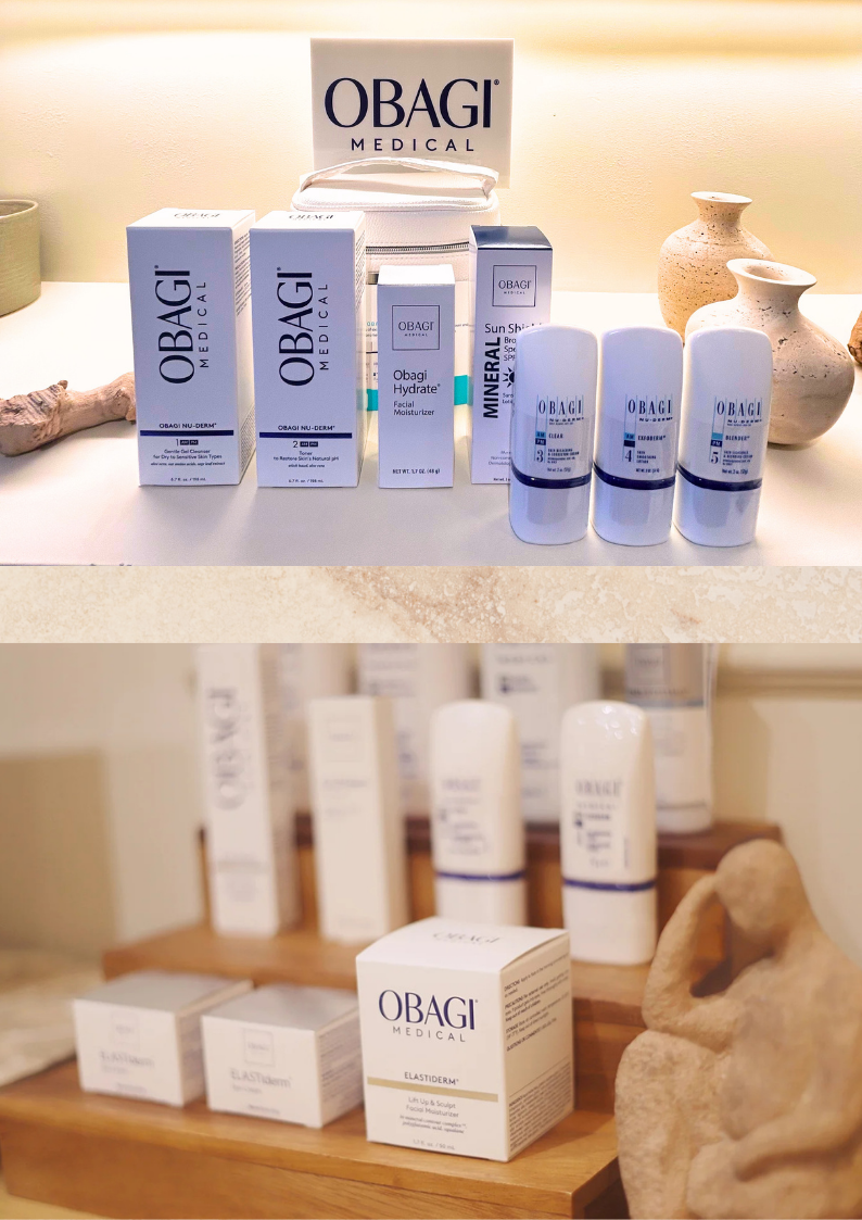 Collection of OBAGI medical skincare products displayed on a shelf, including moisturizers, sunscreens, and facial treatments, next to decorative vases and rocks.