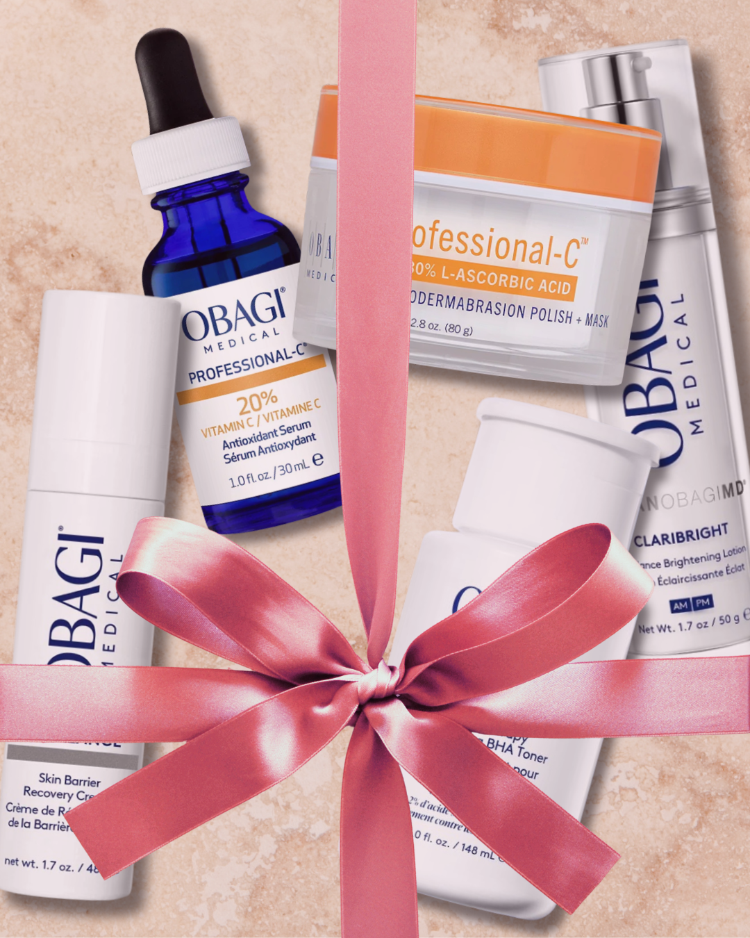 Beauty and skincare products from Obagi Medical, including Vitamin C serum, cleanser, toner, and a face mask, wrapped with a pink ribbon.
