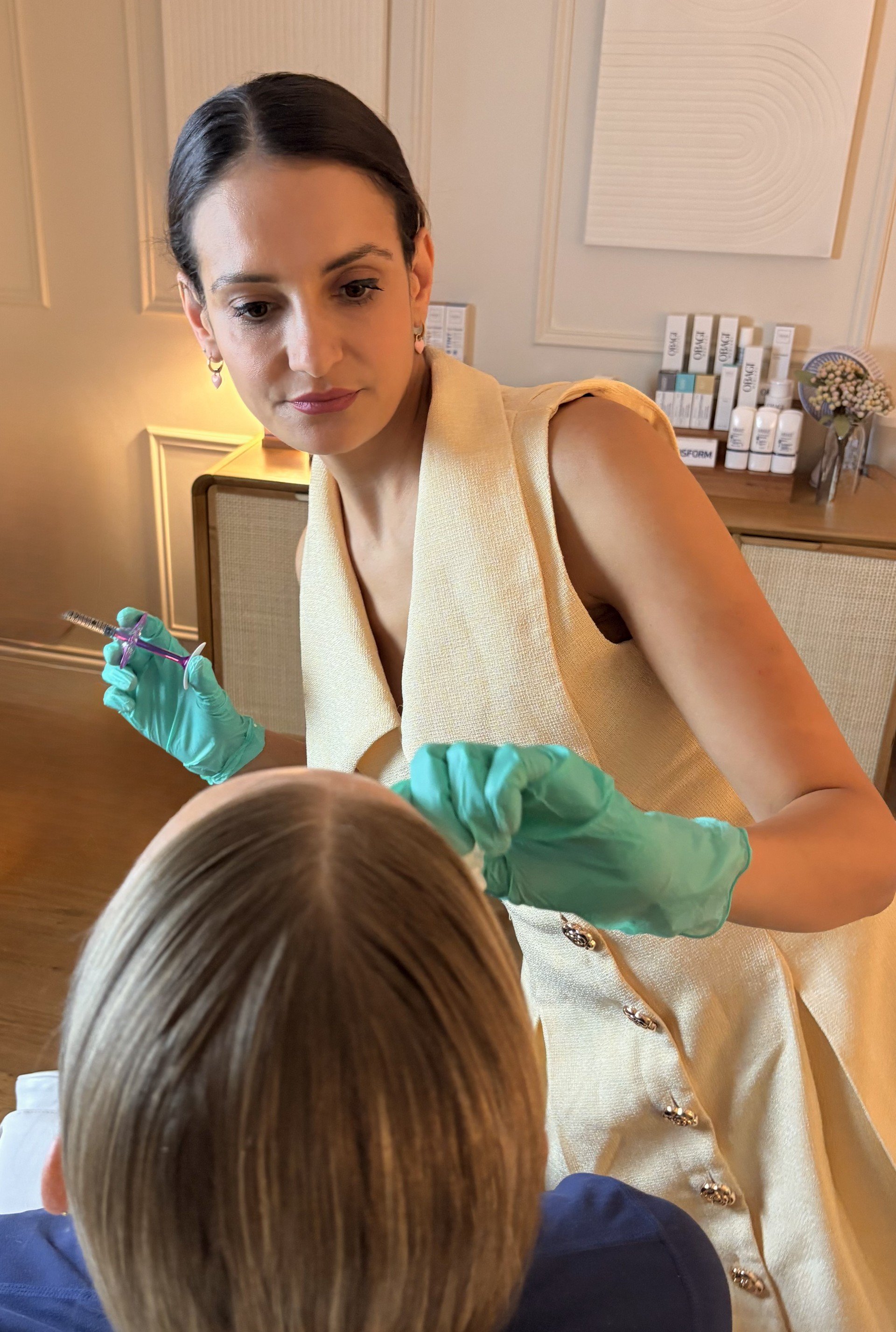 Doctor performing a personalised injectable skin treatment following facial and skin assessment