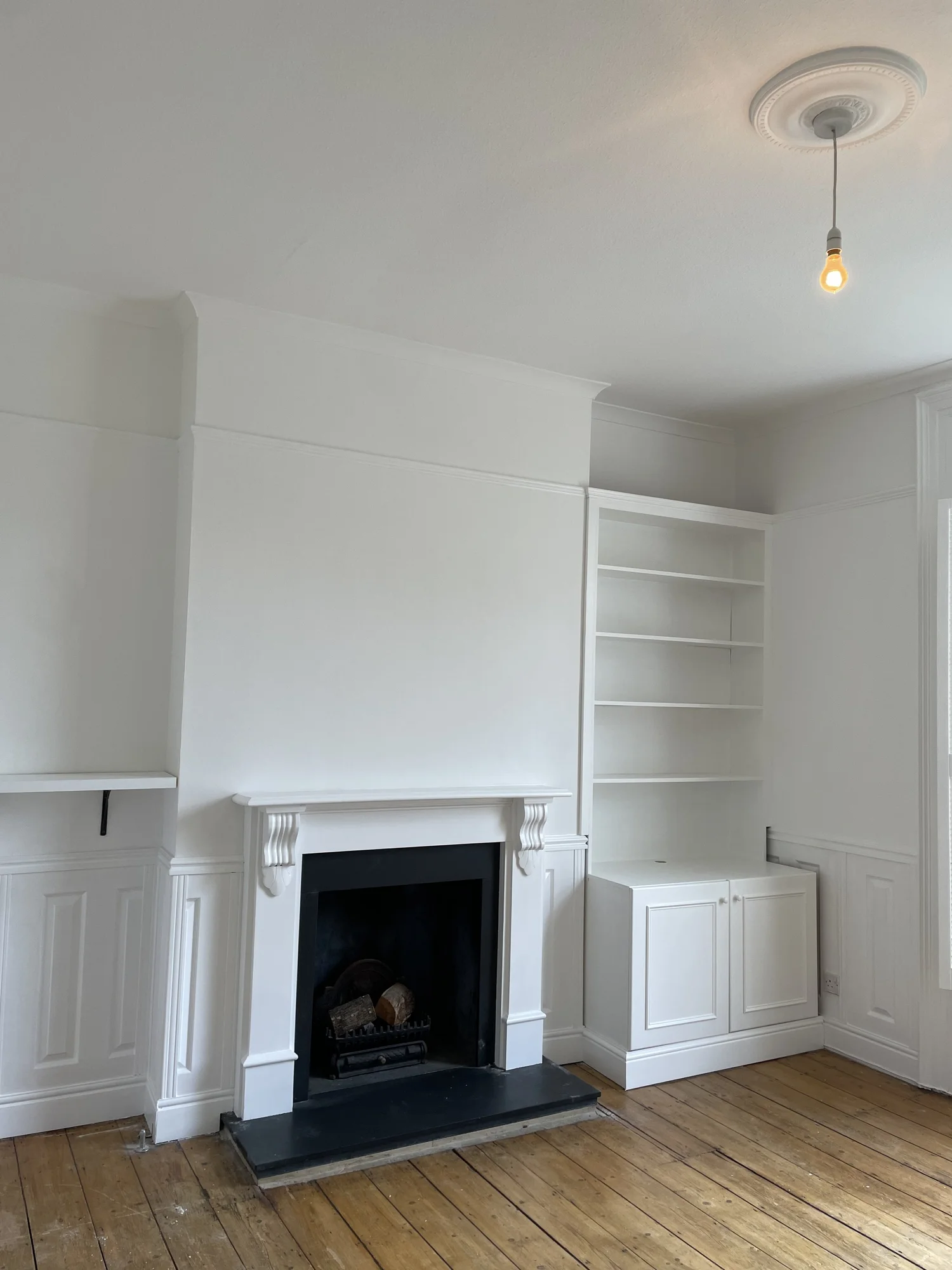 Freshly painted period living room, white walls and ceiling