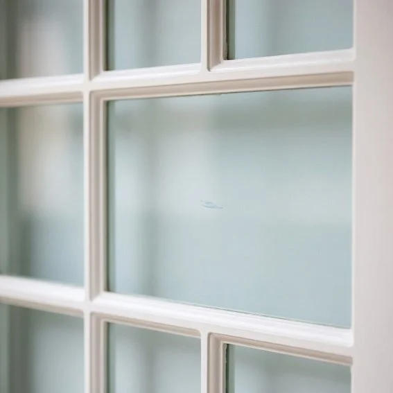 scratched Victorian-style window