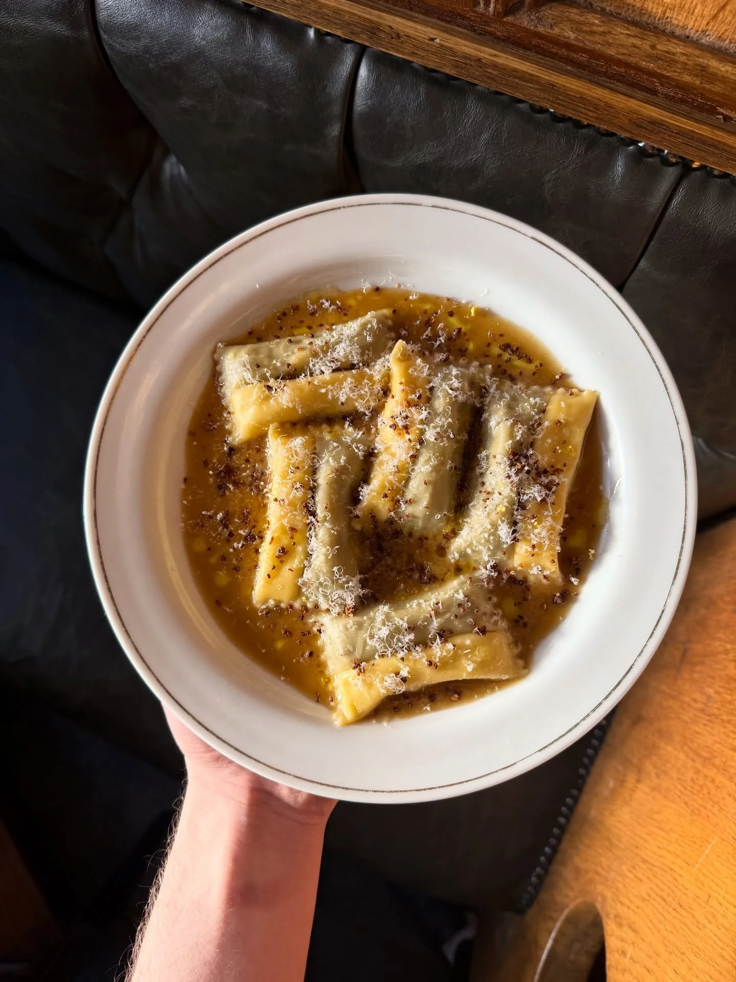 Truffle, mushroom and ricotta doppio ravioli with a mushroom butter sauce and breadcrumbs. 

One side of the ravioli is stuffed with ricotta and the other a mushroom and truffle duxelles with a sharp vinegar spiked mushroom emulsion to cut through th