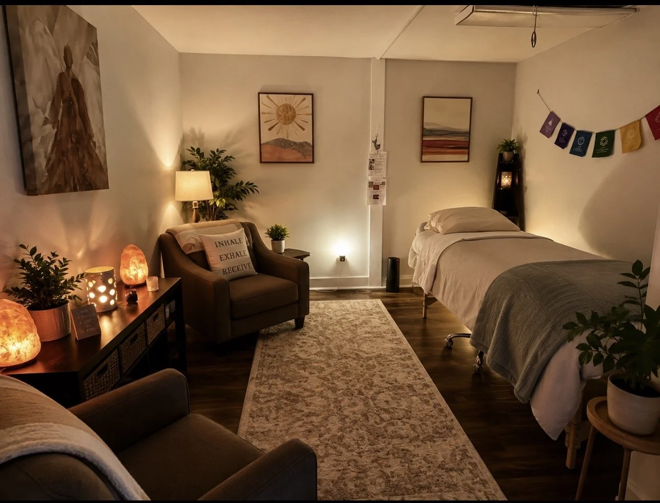Cozy room with a single bed, armchair, side tables with salt lamps, potted plants, wall art, and colorful string banners, illuminated with soft lighting.