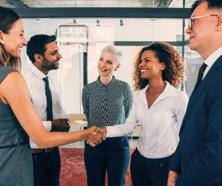 Five people greeting each other