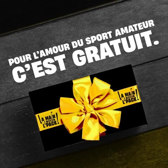 Un coffret cadeau noir avec une bande jaune et un gros ruban jaune en forme de nœud, contenant un pack de produits pour amateur de sport.