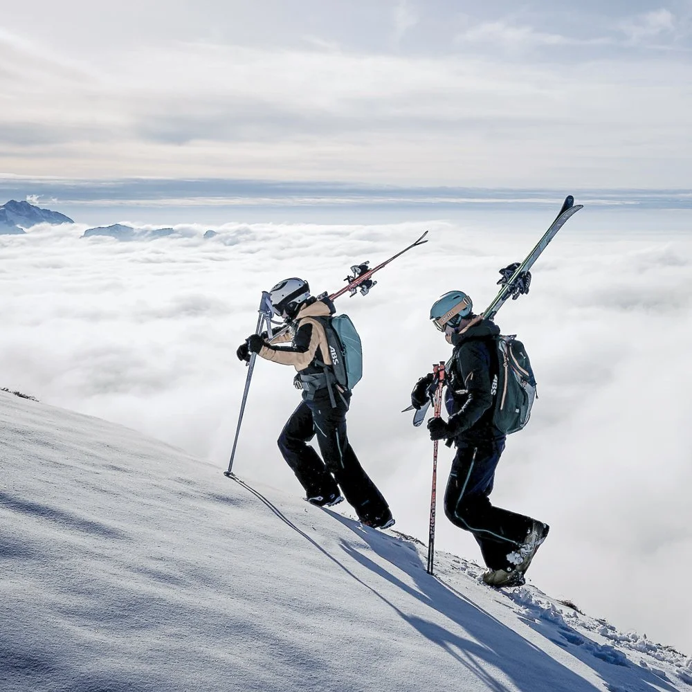Skiers on piste in snowy alpine conditions