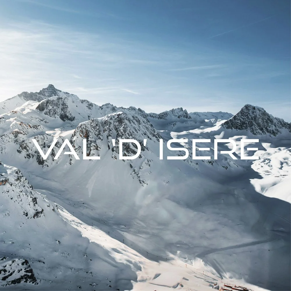 Skier descending snow filled slopes in Val d’Isère ski resort