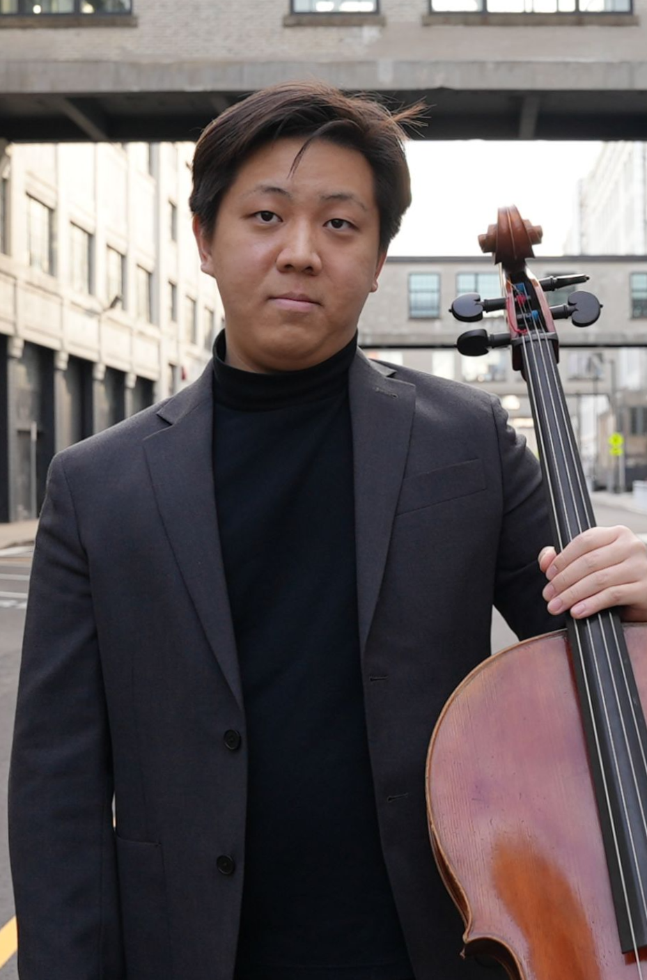Suh William Holding Cello
