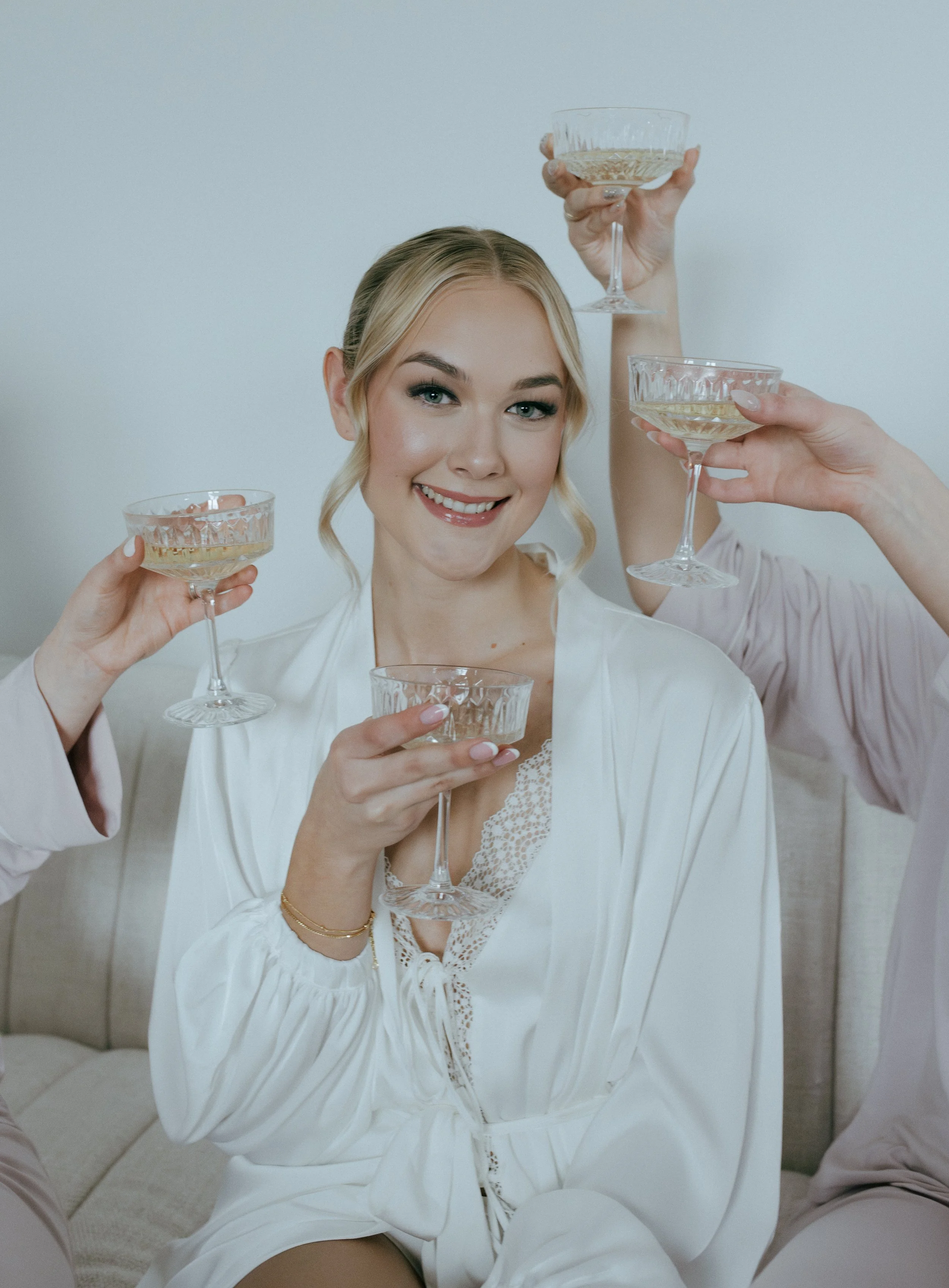 Professional bridal makeup artist creating natural glowing wedding makeup look