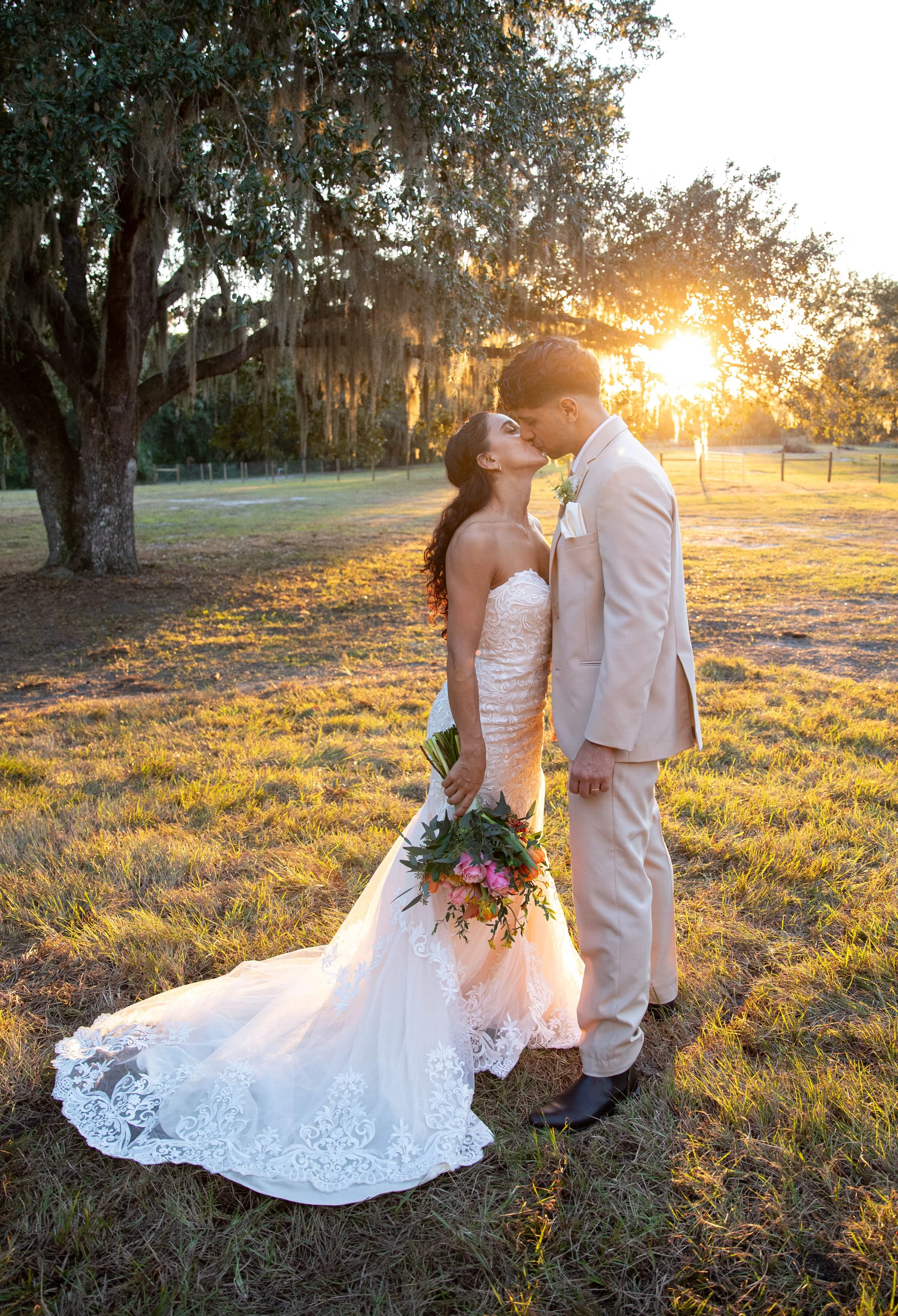 Wedding Couple Kissing at Sunset