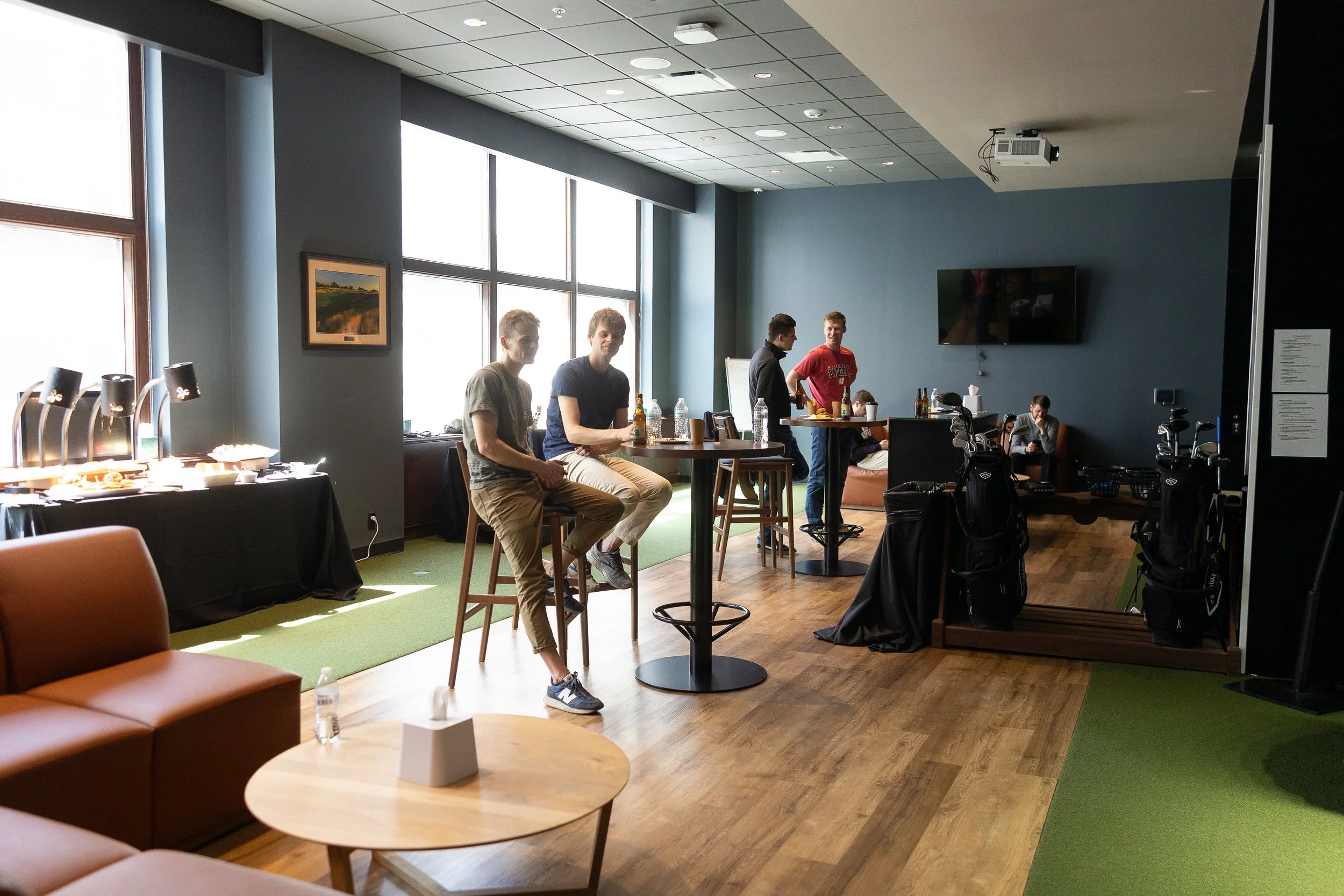 Groomsmen gathered in the golf suite at Milwaukee Athletic Club.