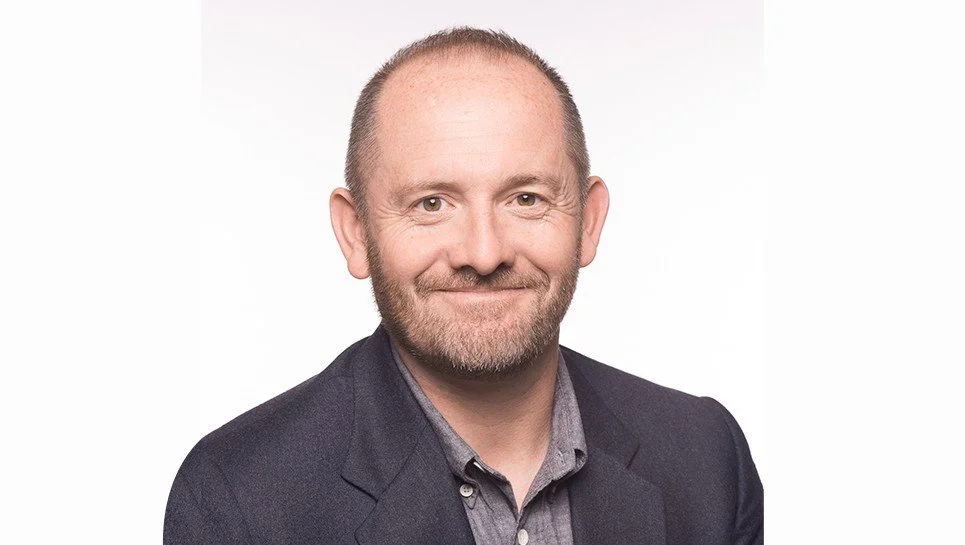 Man with a beard and a dark jacket