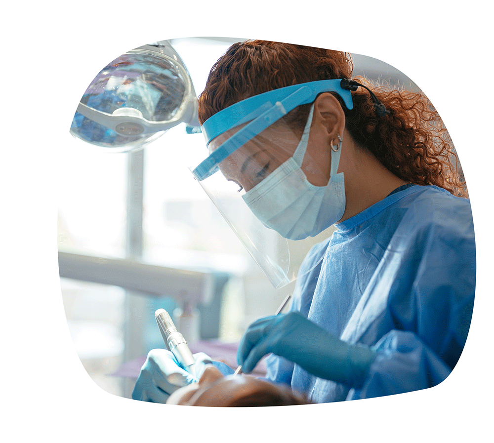 Dental hygienist working on a patient